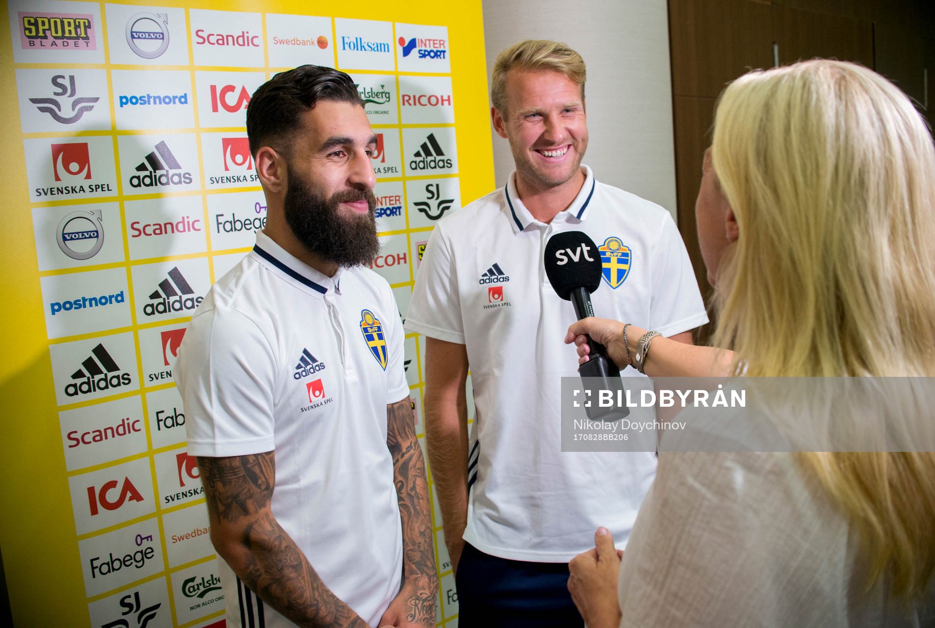 Swedish player Jimmy Durmaz (l) and Ola Toivonen meet media