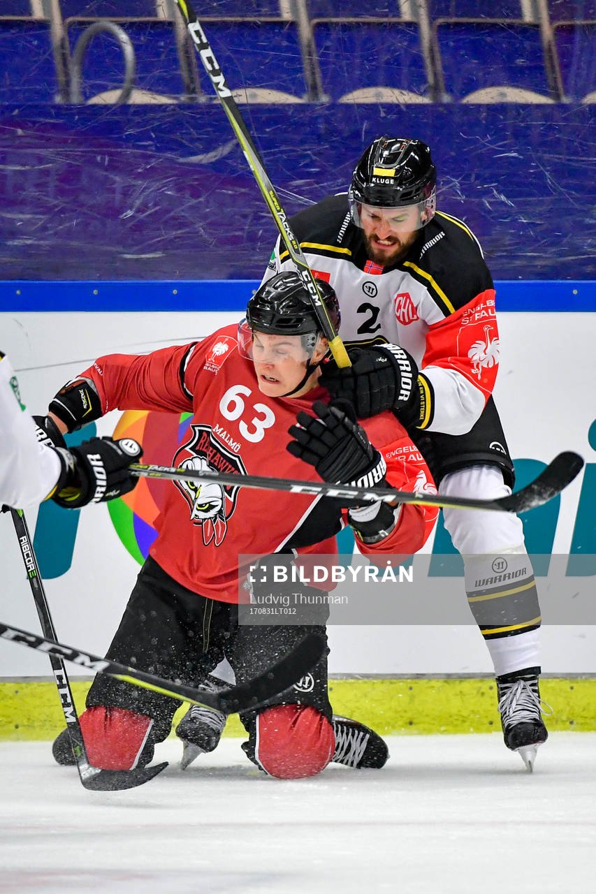 Fredrik Händemark of Malmö Redhawks and Spencer Humphries