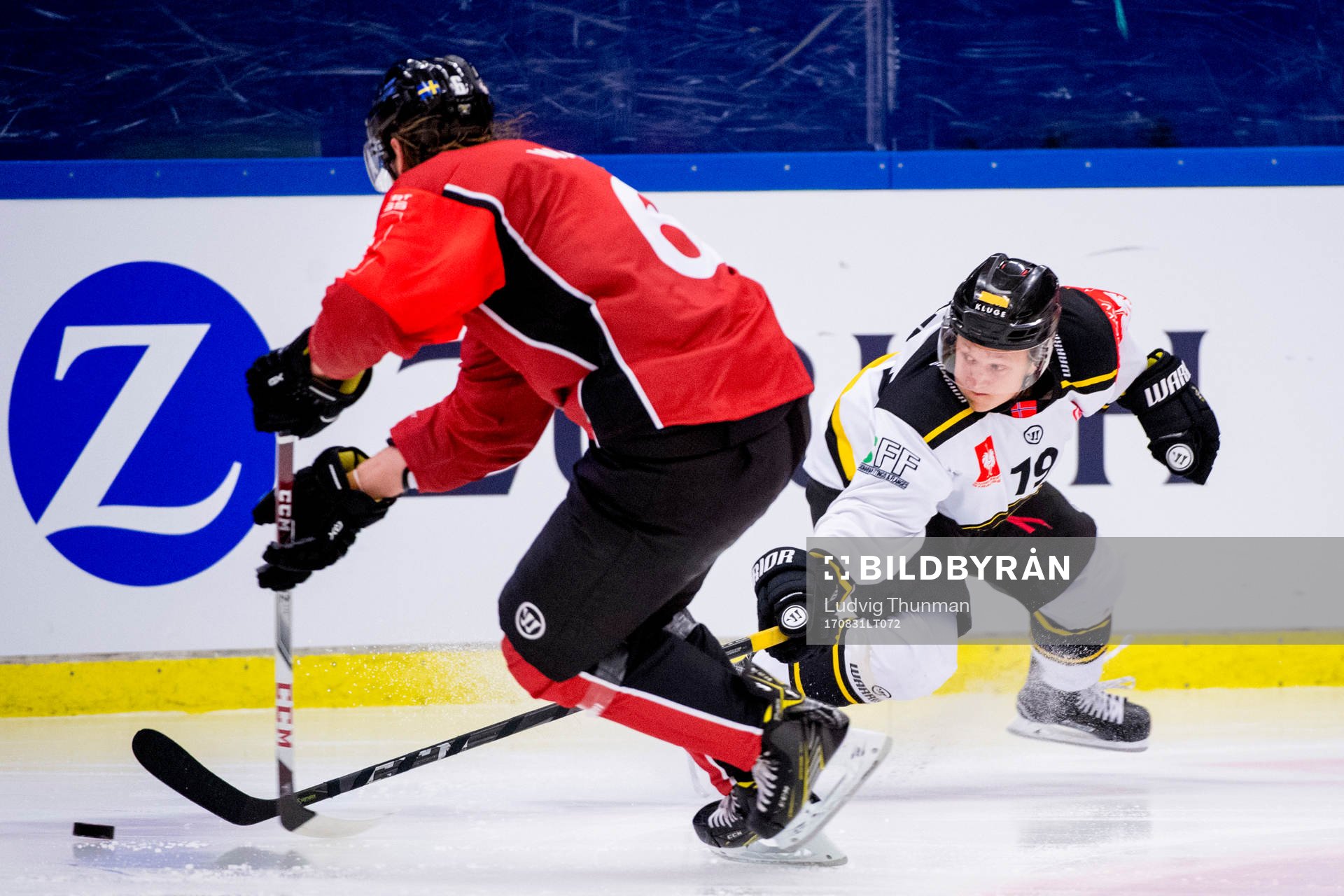 Magnus Hoff of Magnus Hoff reaches for the puck from Stefan