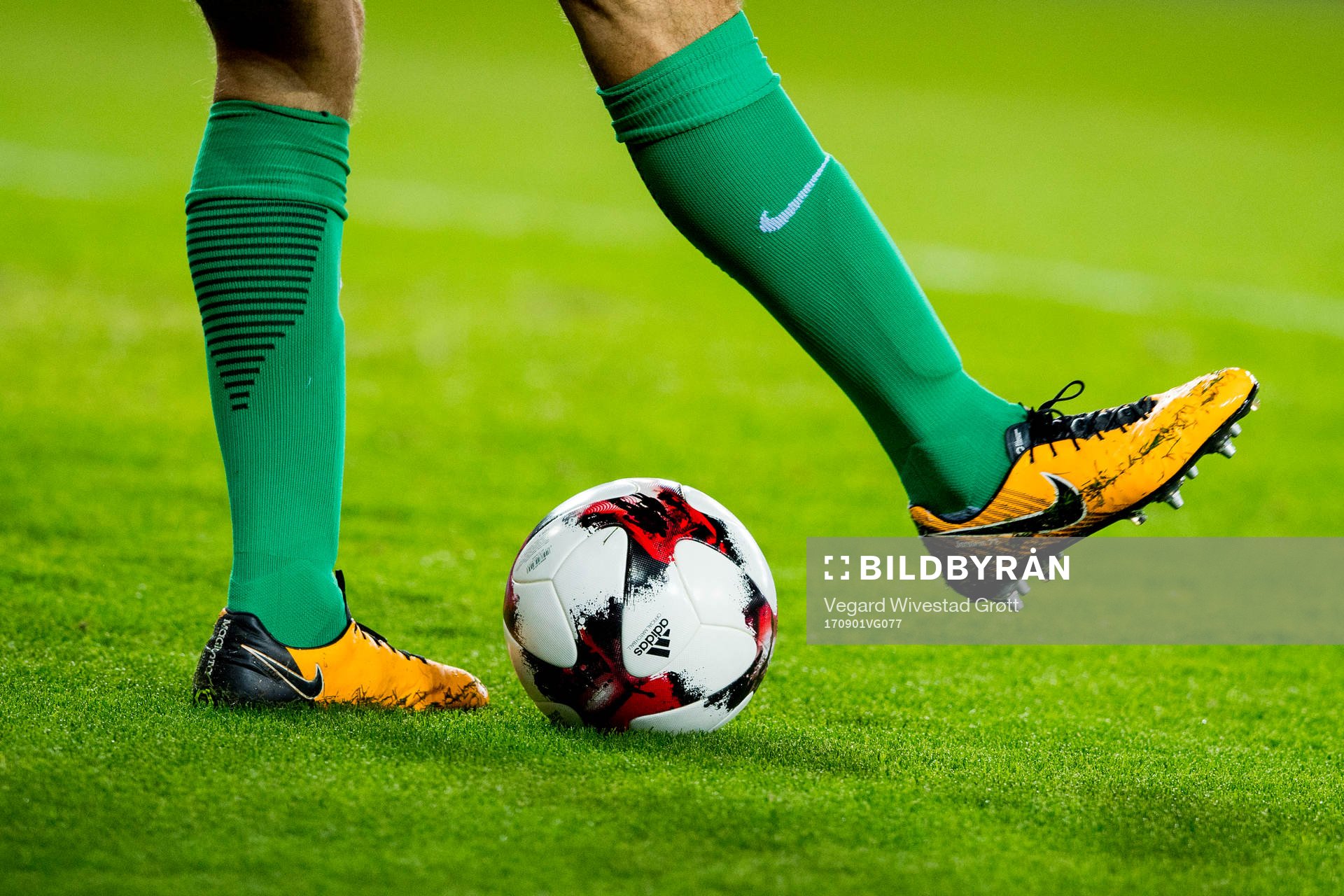 A goalkeeper with a football