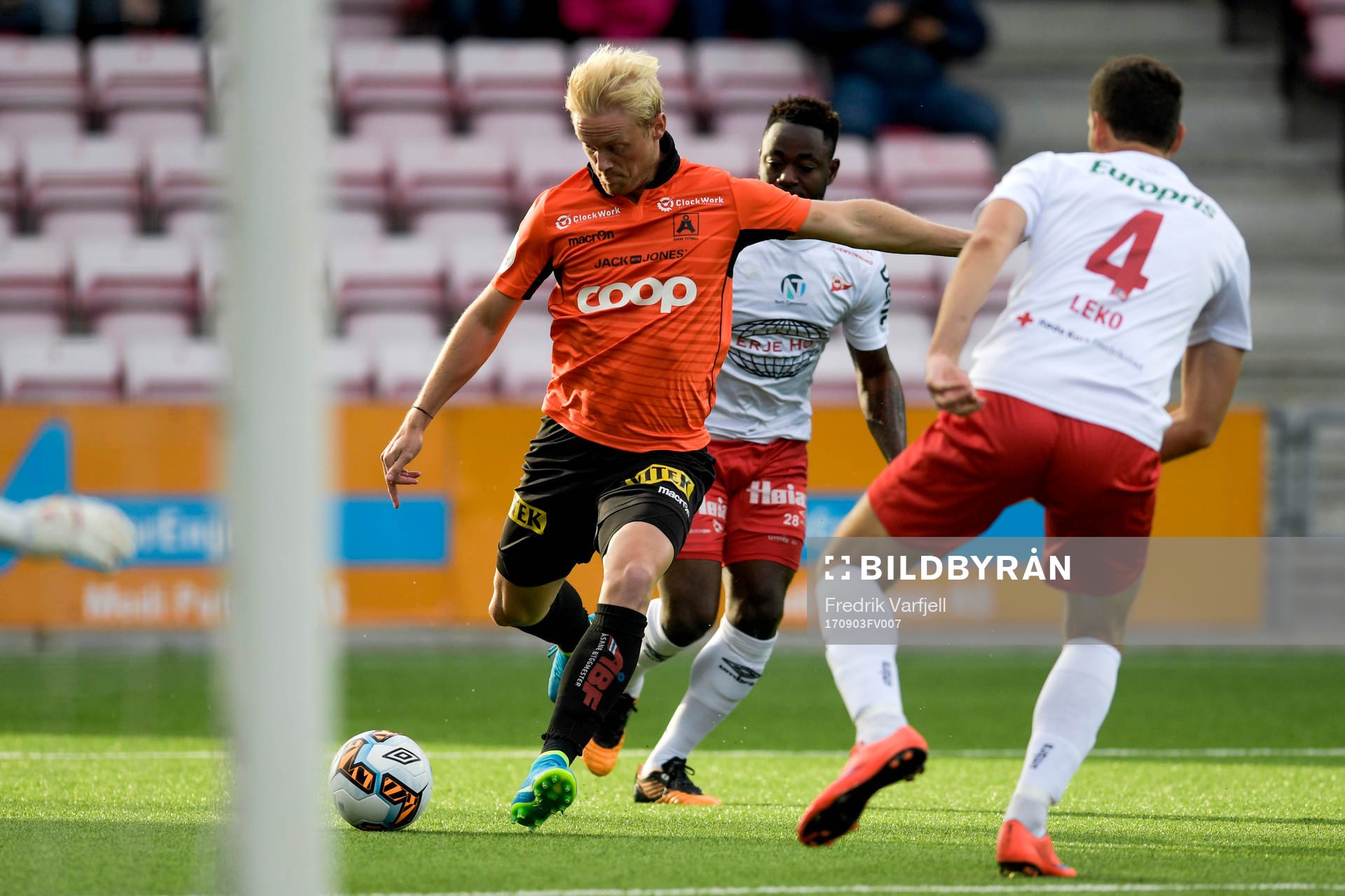 Geir André Herren of Åsane and Razak Nuhu and Mislav Leko of Fredrikstad during the OBOS-ligaen match between Fredrikstad and Åsane on September 3, 2017 in Fredrikstad.