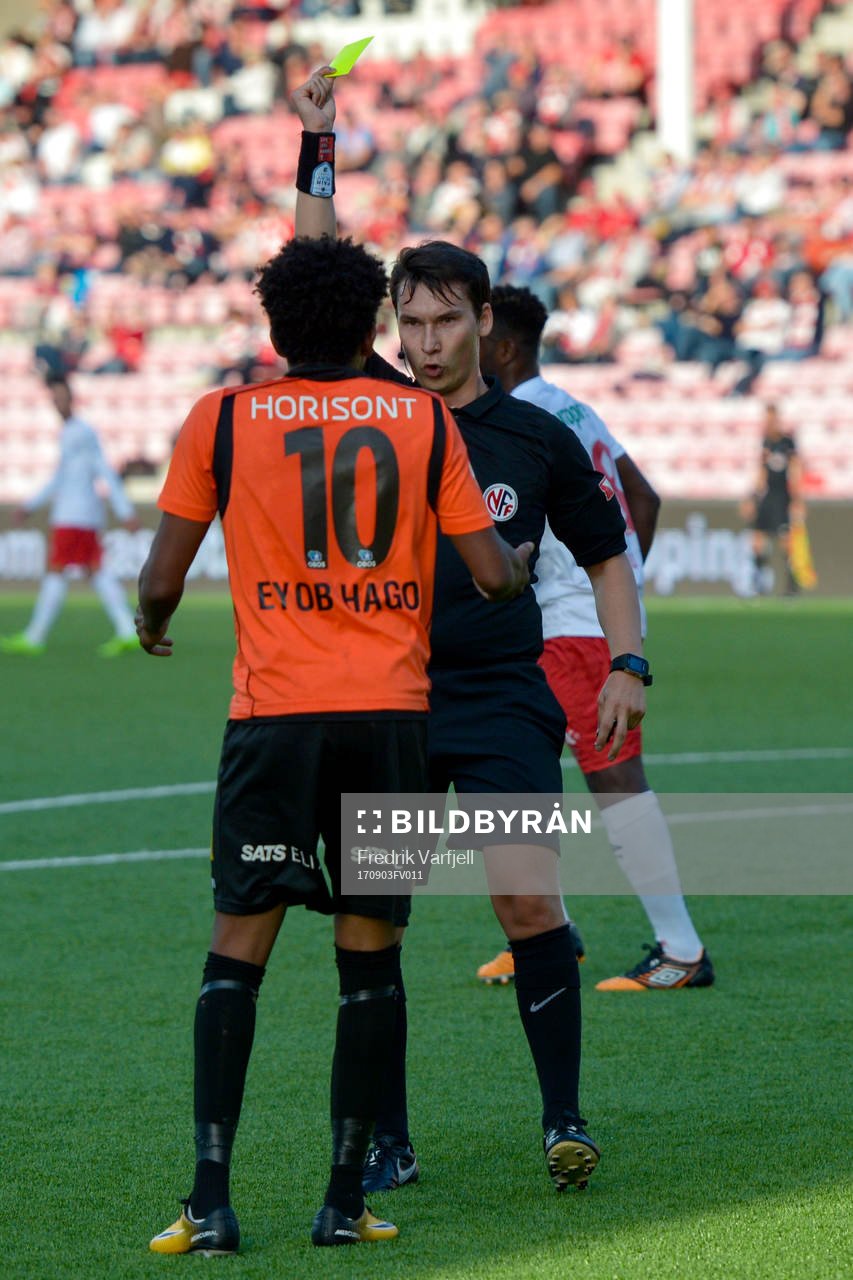 Senai Eyob Hagos of Åsane is shown a yellow card