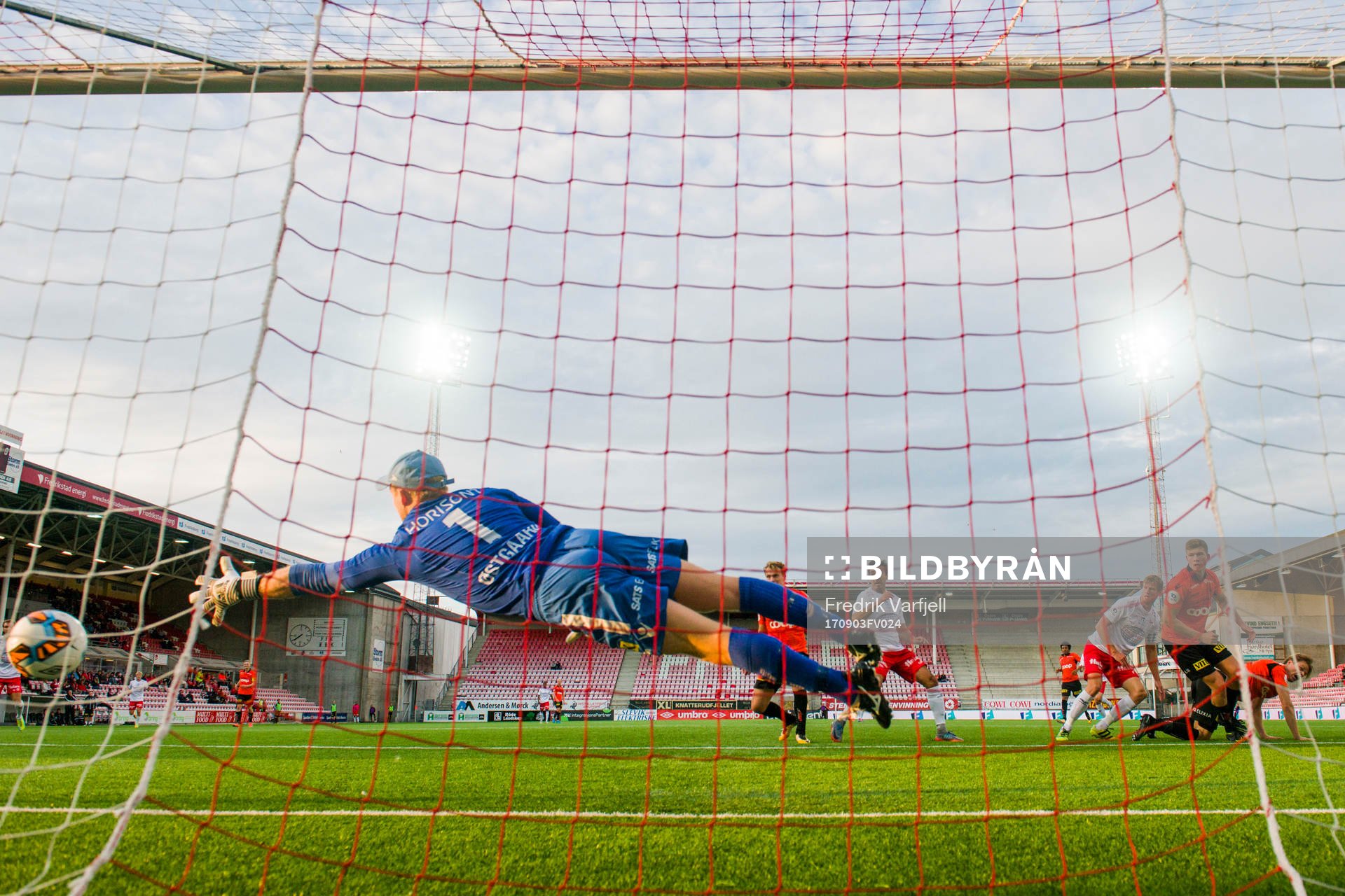 Ulrik Flo of Fredrikstad scores 1-1 behind Åsane goalkeeper Eirik Østgaard during the OBOS-ligaen match between Fredrikstad and Åsane on September 3, 2017 in Fredrikstad.