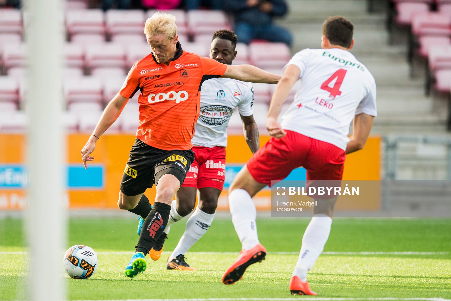 Geir André Herren of Åsane, Razak Nuhu and Mislav Leko of