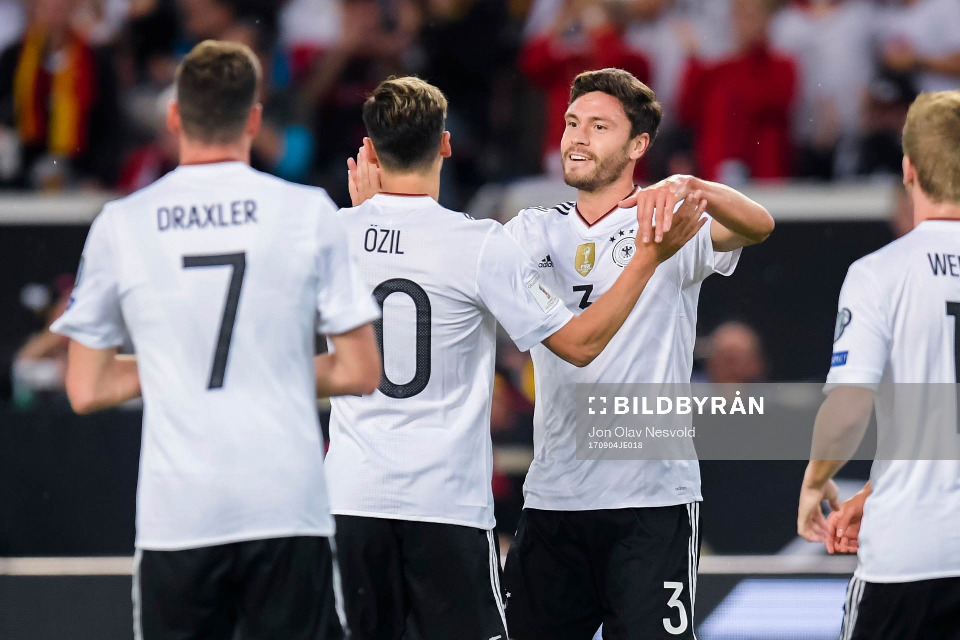 Jonas Hector of Germany celebrates with teammate Mesut Özil