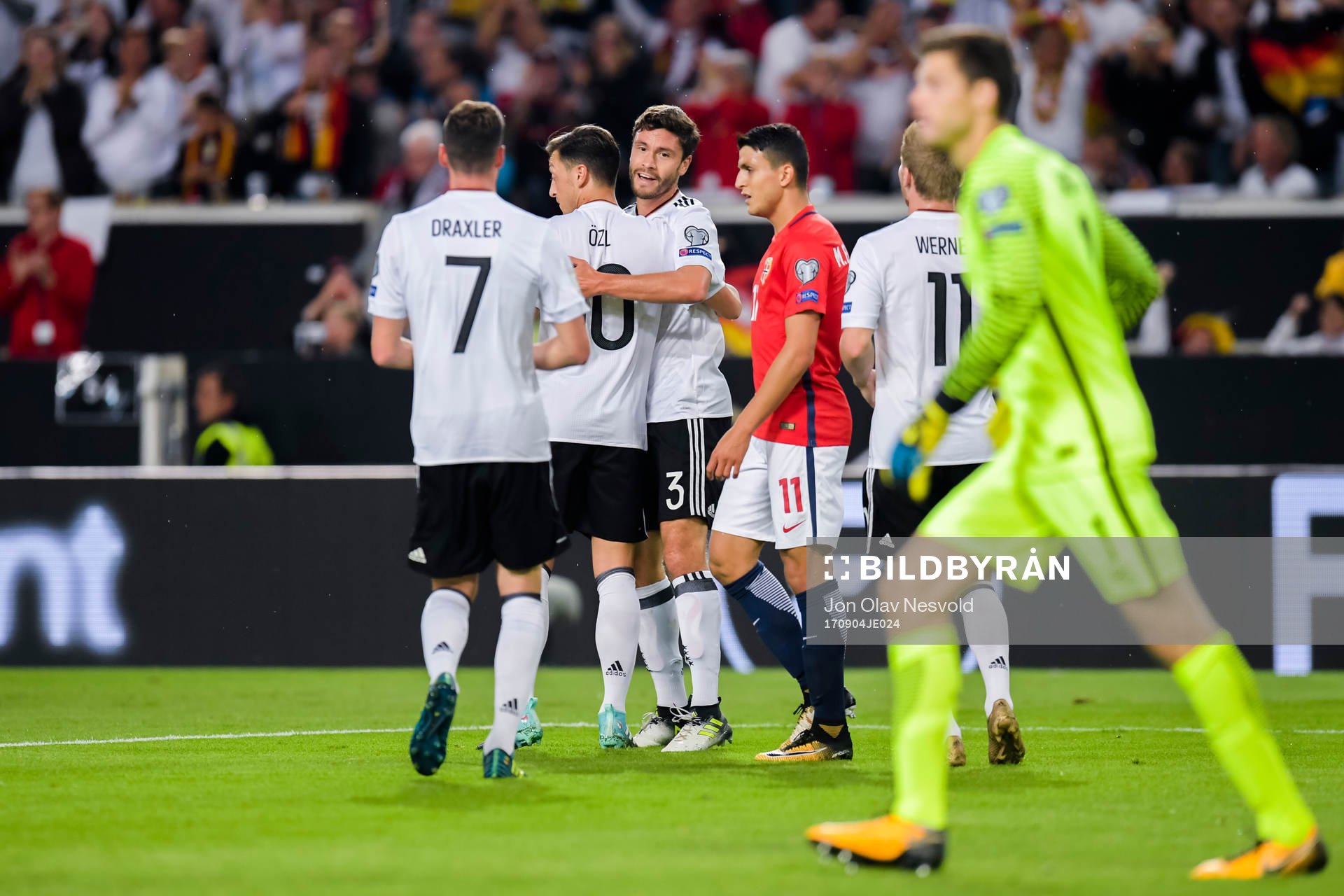 Mesut Özil of Germany celebrates with teammate Jonas Hector after scoring the 1-0 goal during the FIFA World Cup Qualifier match between Germany and Norway on September 4, 2017 in Stuttgart.