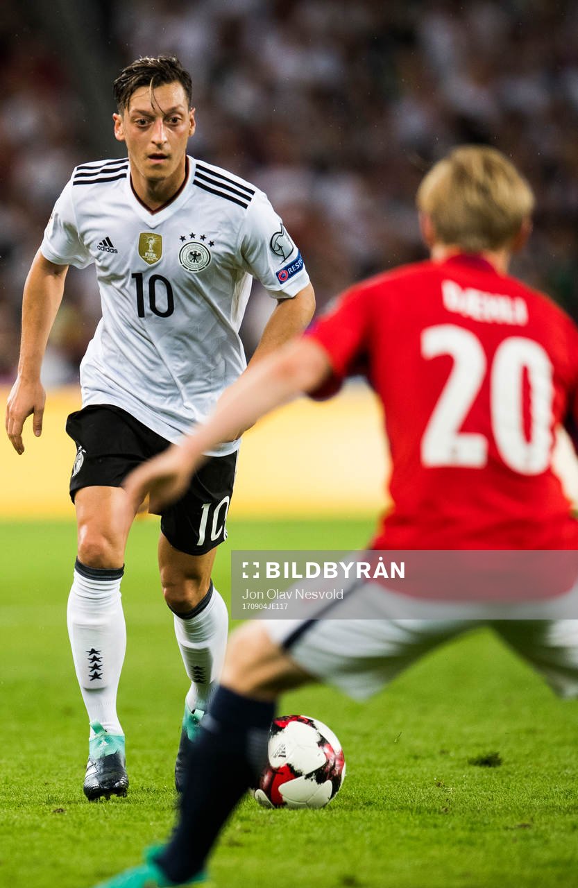 Mesut Özil of Germany and Mats Møller Dæhli of Norway