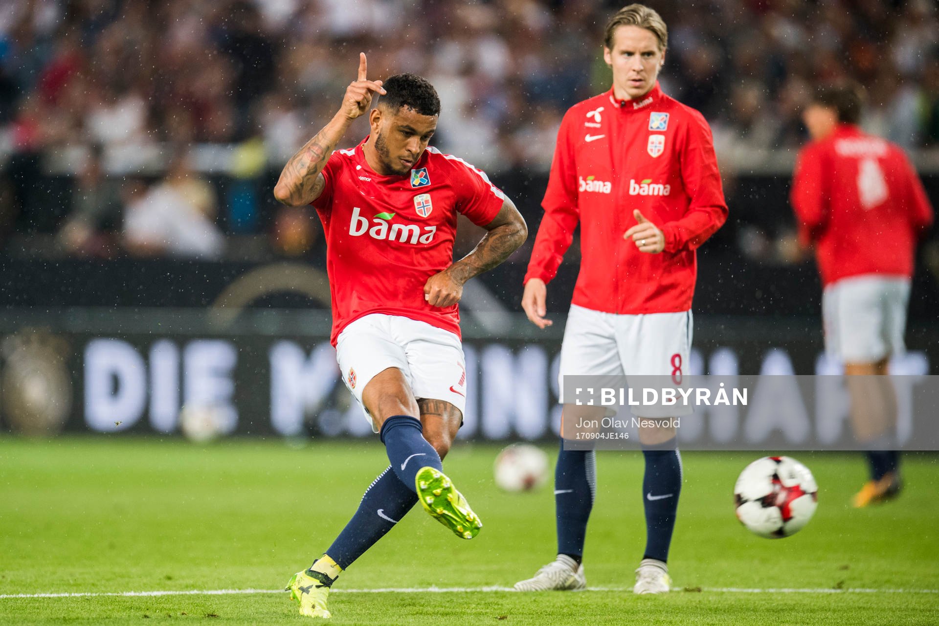 Joshua King and Stefan Johansen of Norway is warming up