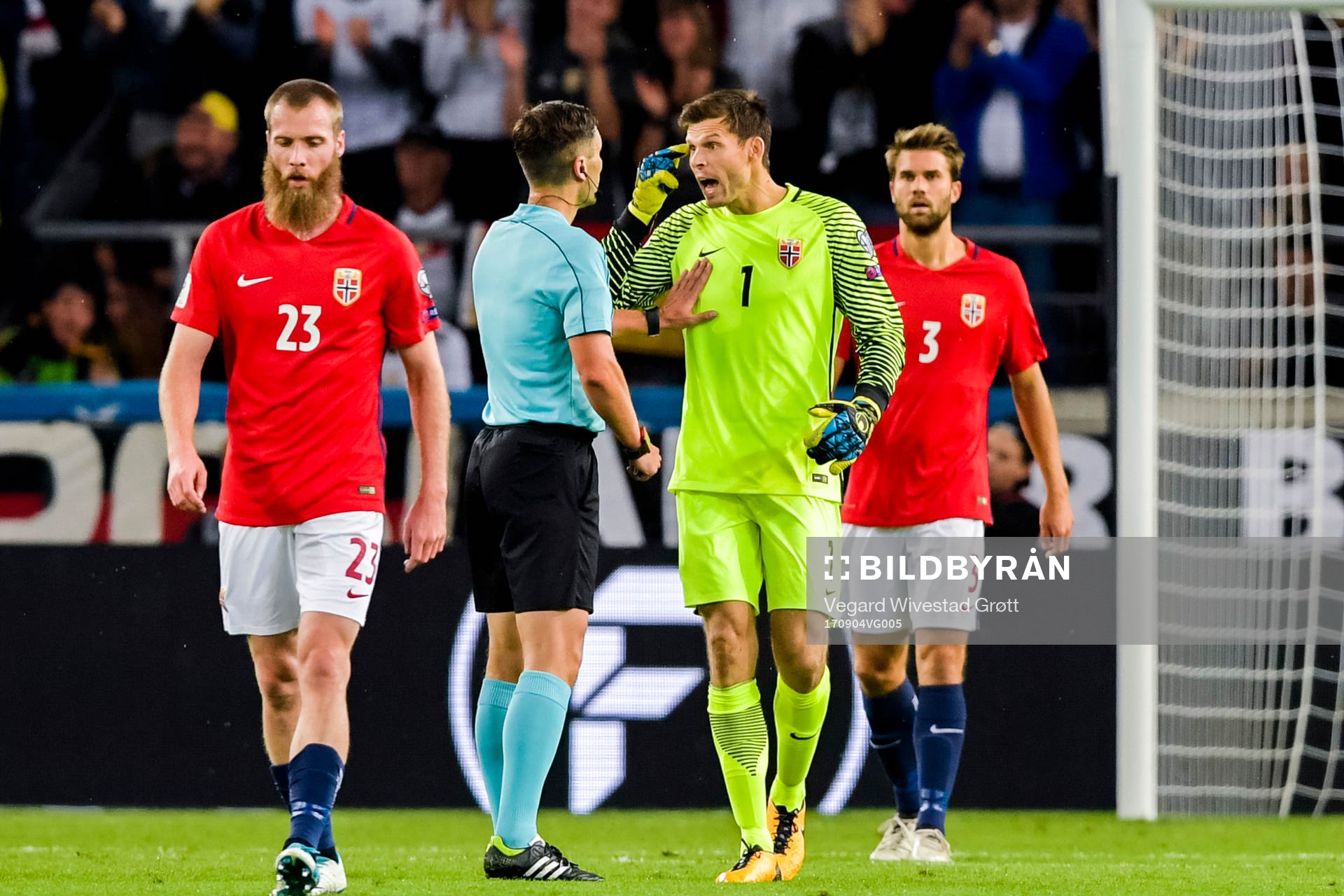 Norway's goalkeeper Rune Almenning Jarstein of Norway argue