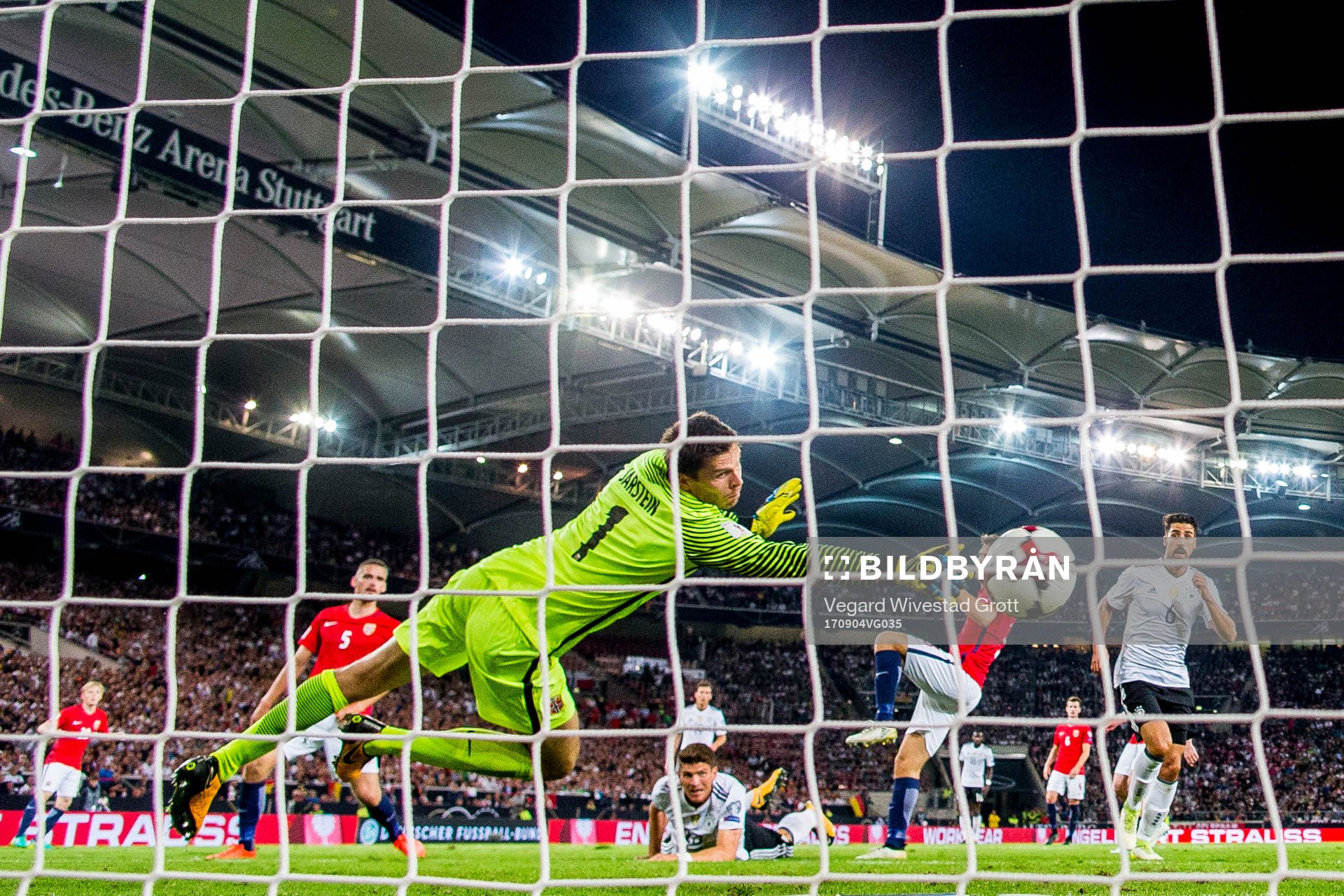 Mario Gomez of Germany scores 6-0 behind goalkeeper Rune