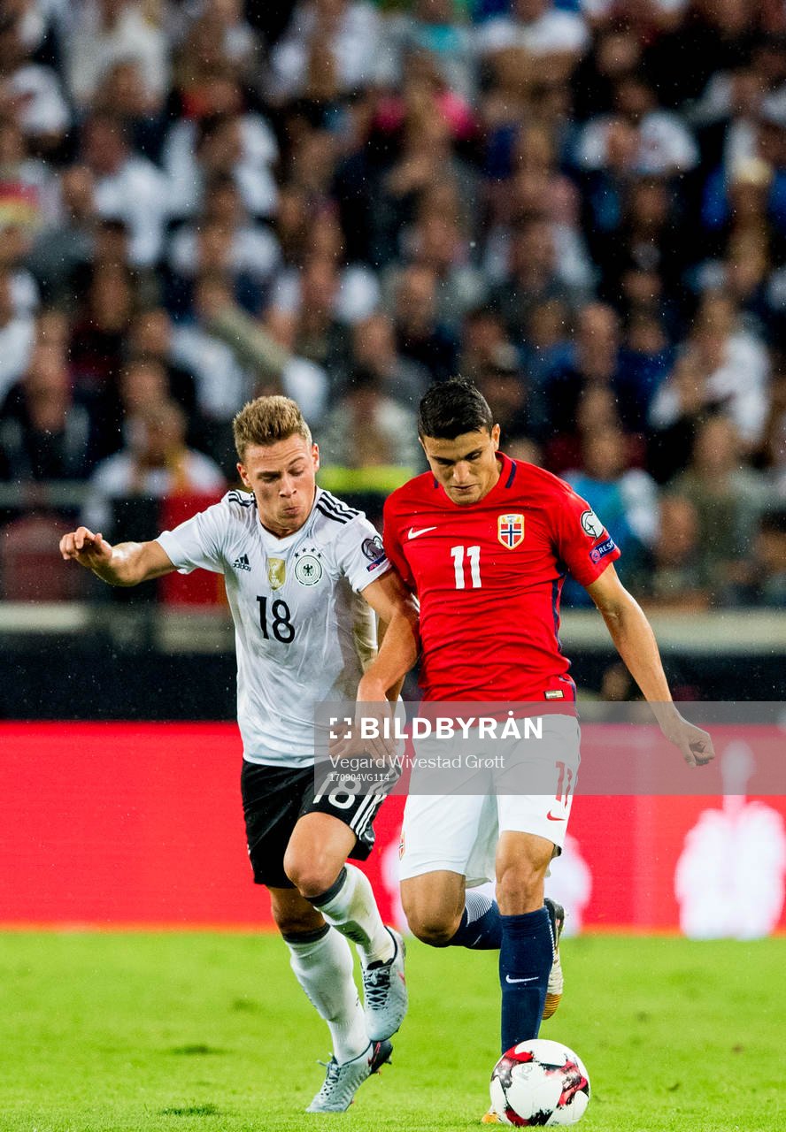 Joshua Kimmich of Germany and Mohamed Elyounoussi of Norway
