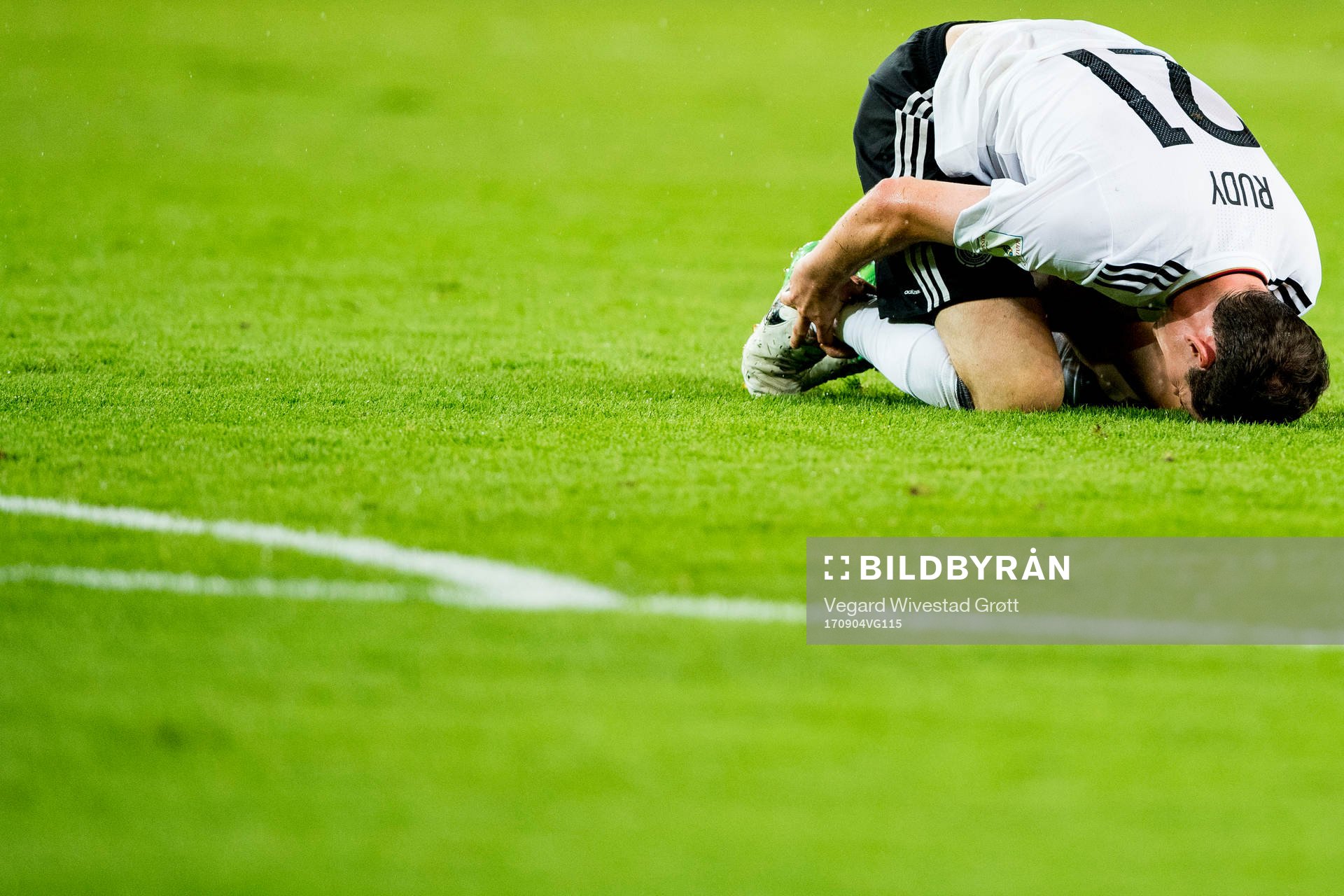 Sebastian Rudy of Germany lies down