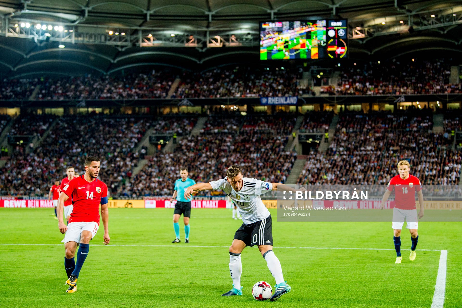 Omar Elabdellaoui of Norway and Mesut Özil of Germany