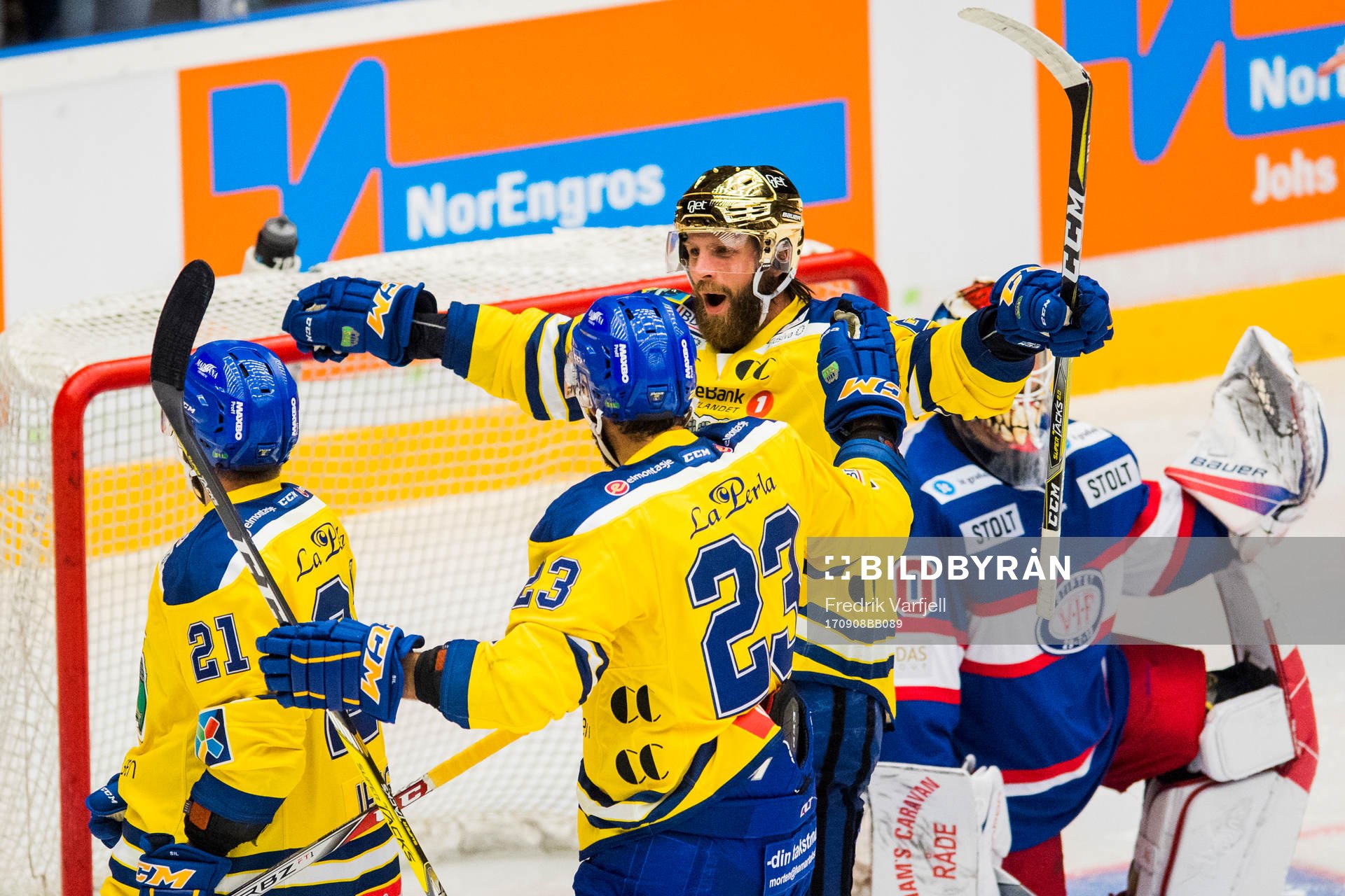 Joakim Jensen of Storhamar celebrates with his teammates