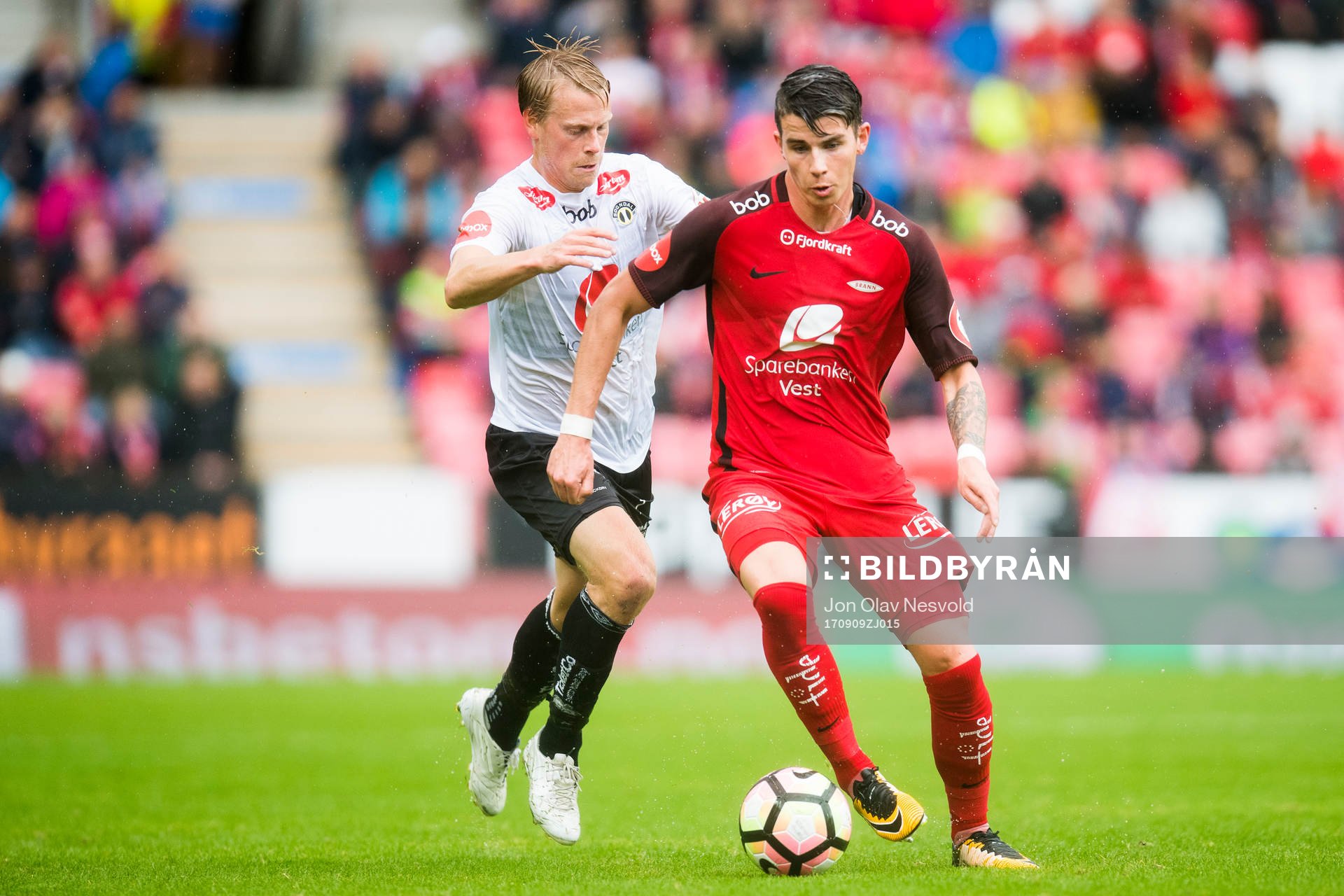 Eirik Schulze of Sogndal competes for the ball with Vidar