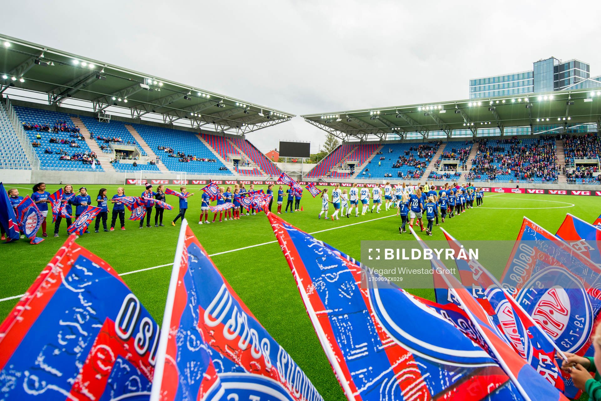 The teams enter the pitch
