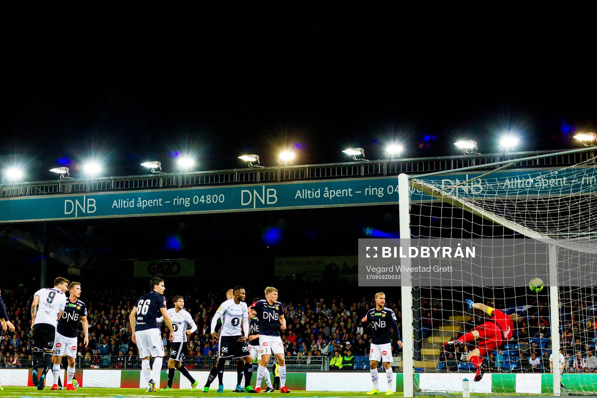 Nicklas Bendtner of Rosenborg scores 0-1 behind goalkeeper