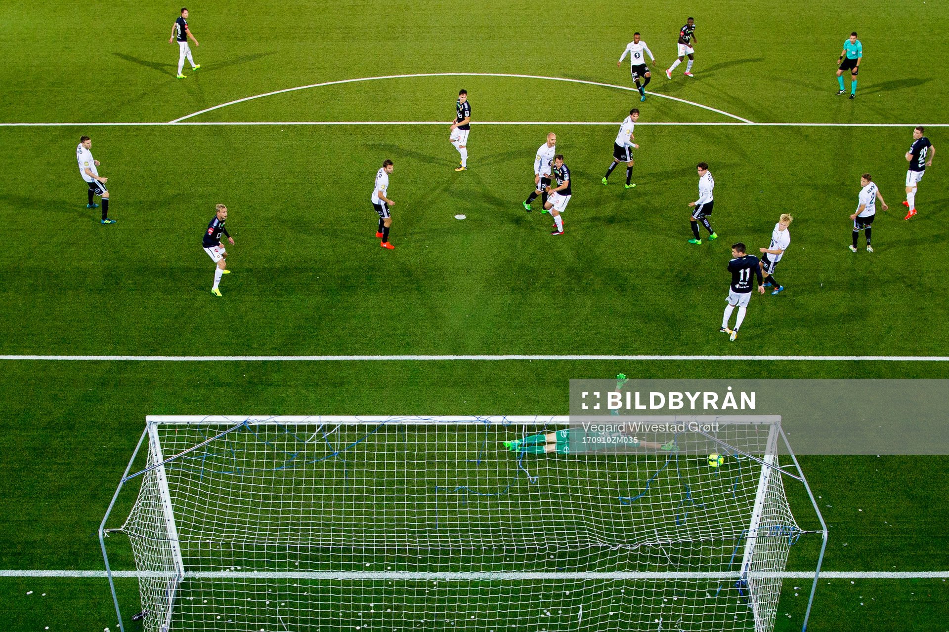 Francisco Junior of Strømsgodset hits the post behind