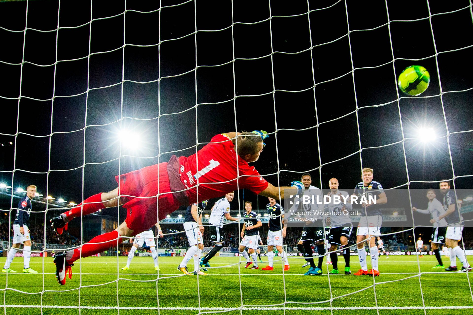 Nicklas Bendtner of Rosenborg scores 0-1 behind goalkeeper