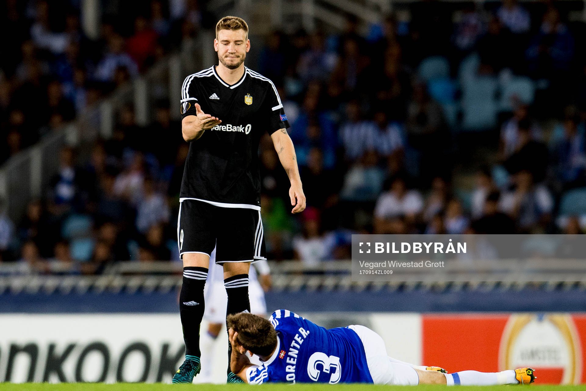 Nicklas Bendtner of Rosenborg and Diego Llorente of Real Sociedad during the UEFA Europa League match between Real Sociedad and Rosenborg on September 14, 2017 in San Sebastian.