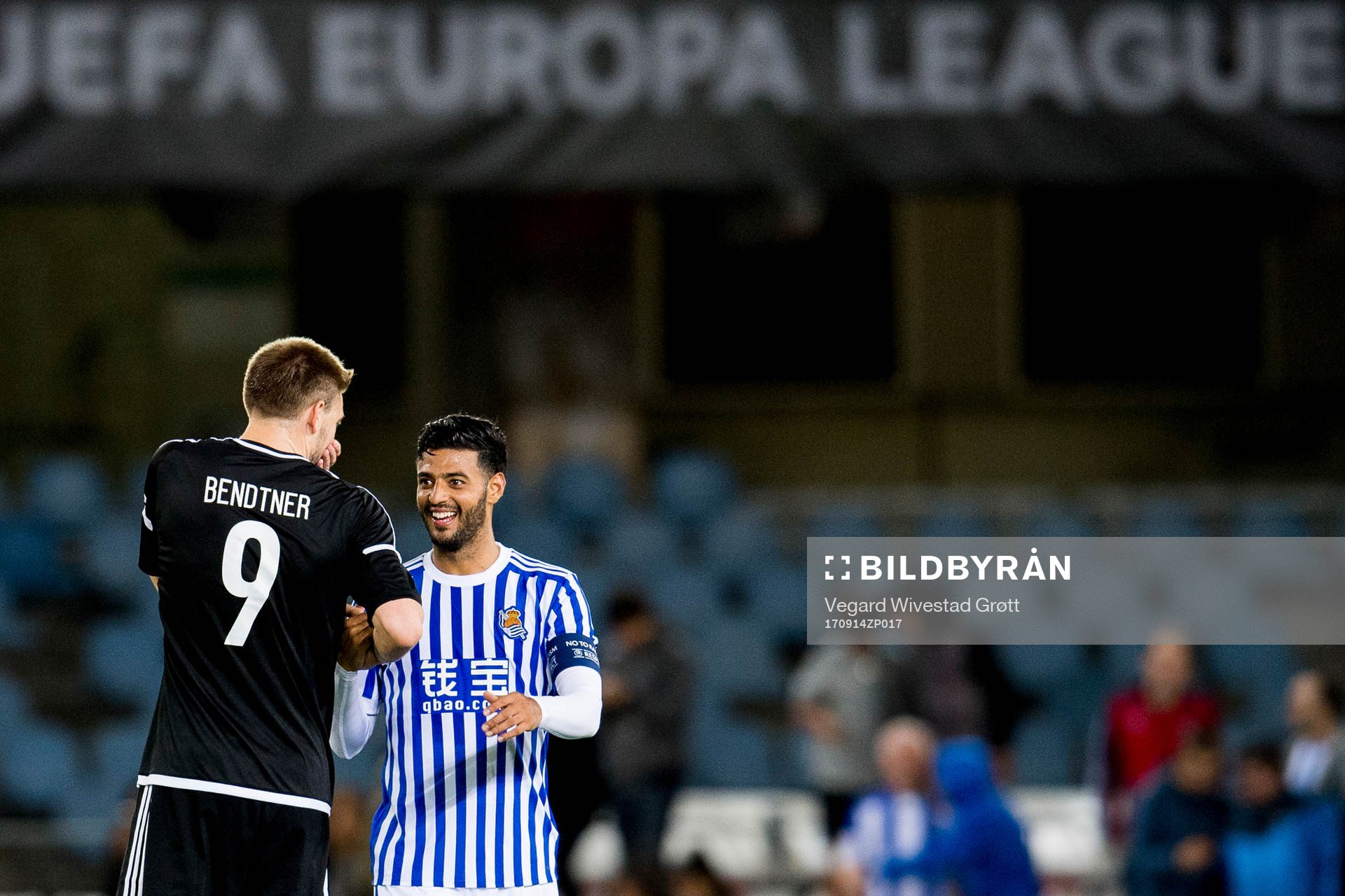 Nicklas Bendtner of Rosenborg talks to Carlos Vela of Real