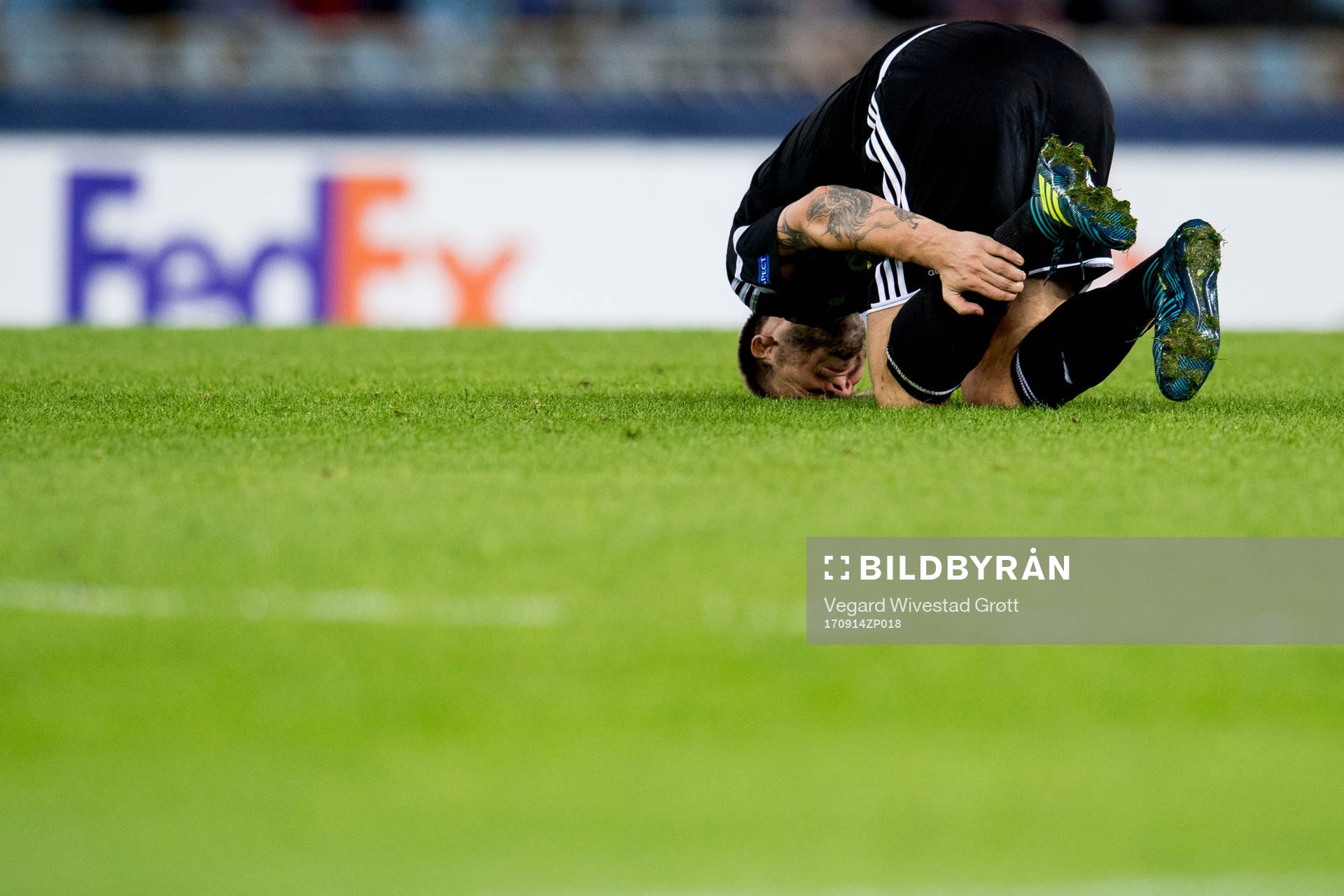 Nicklas Bendtner of Rosenborg lies down