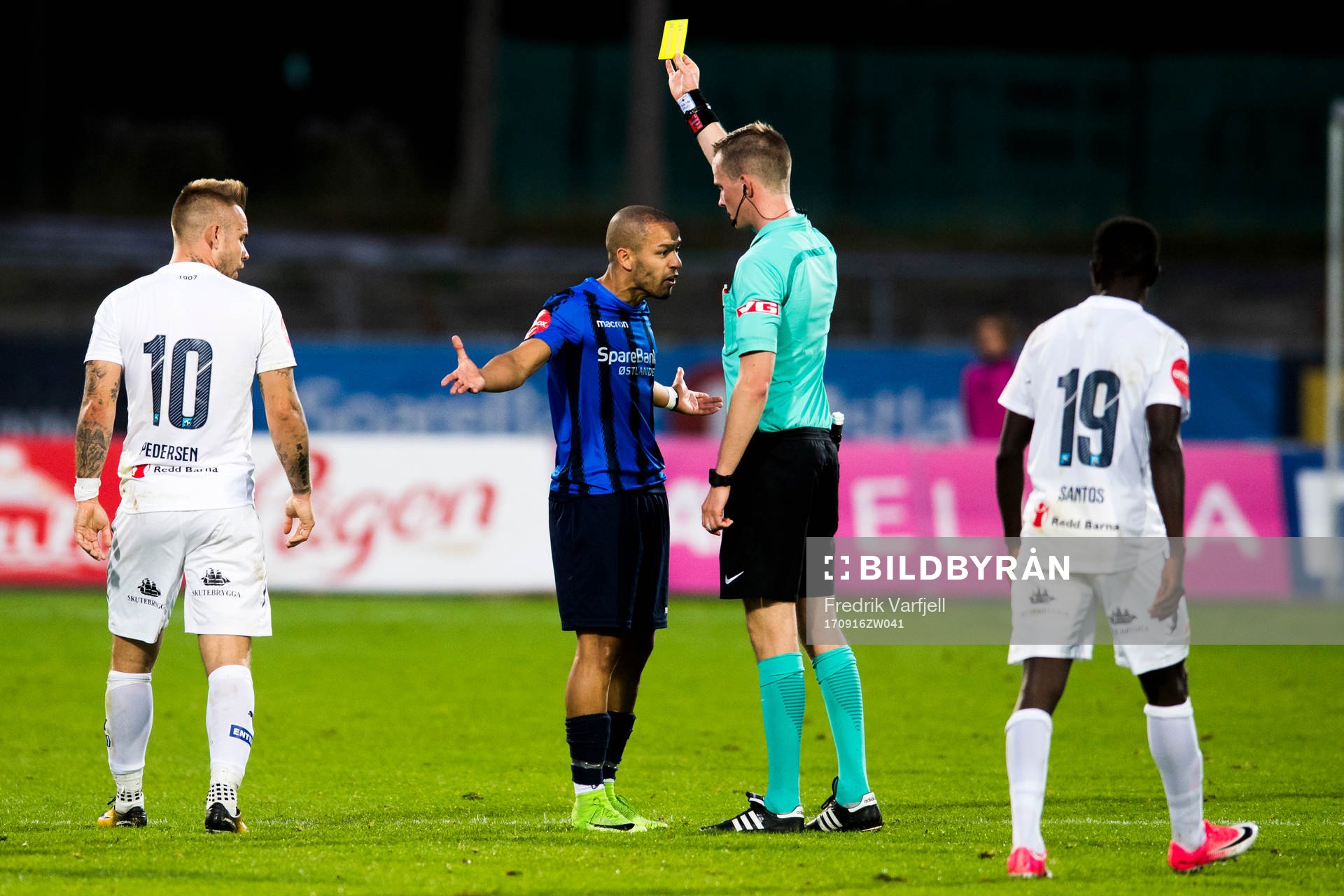 Ahmed el Amarani of Stabæk is shown a yellow card by the