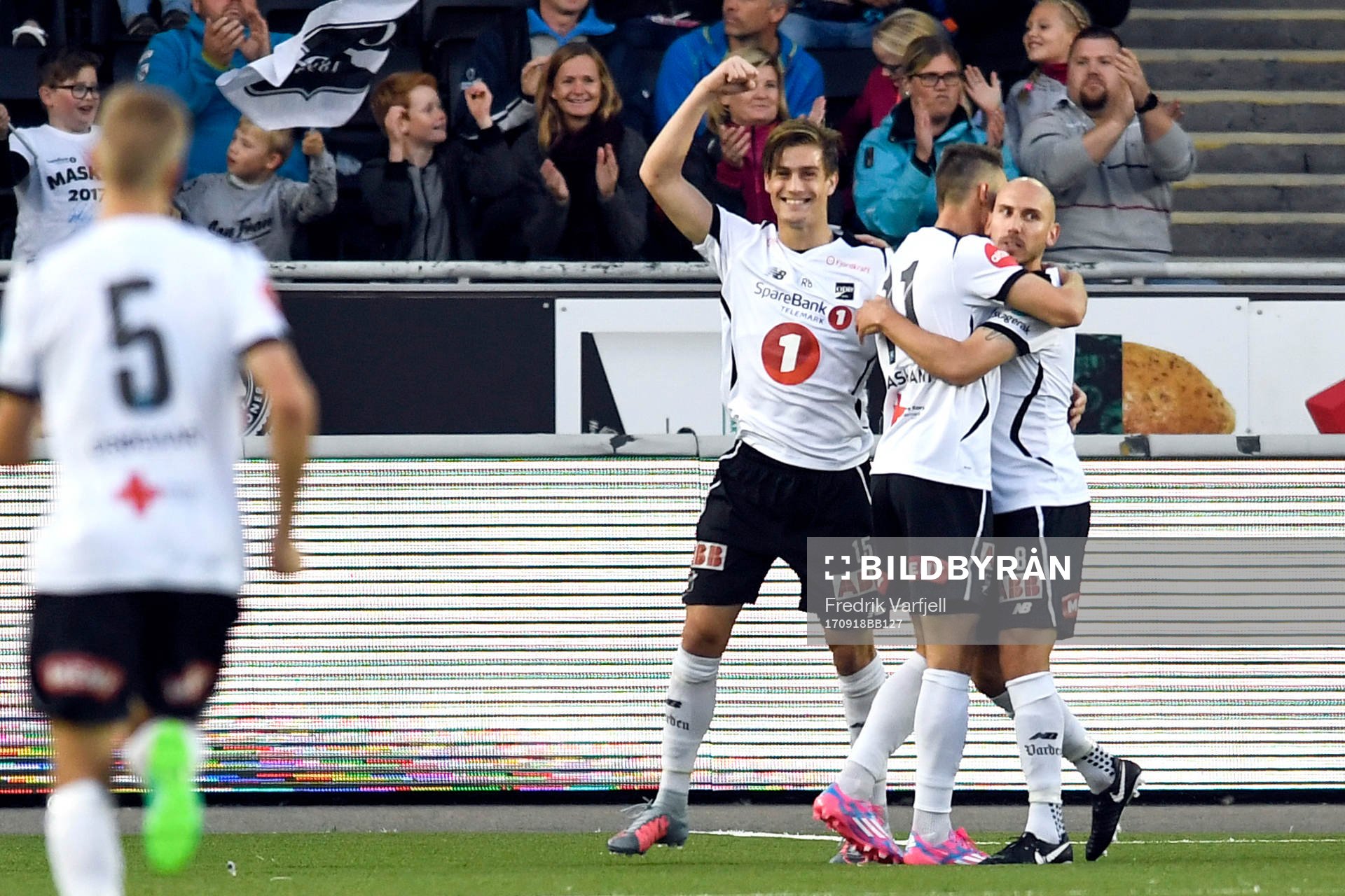 Jone Samuelsen of Odd celebrates with his teammates after scoring 1-0 during the Eliteserien match between Odd and Aalesund on September 18, 2017 in Skien