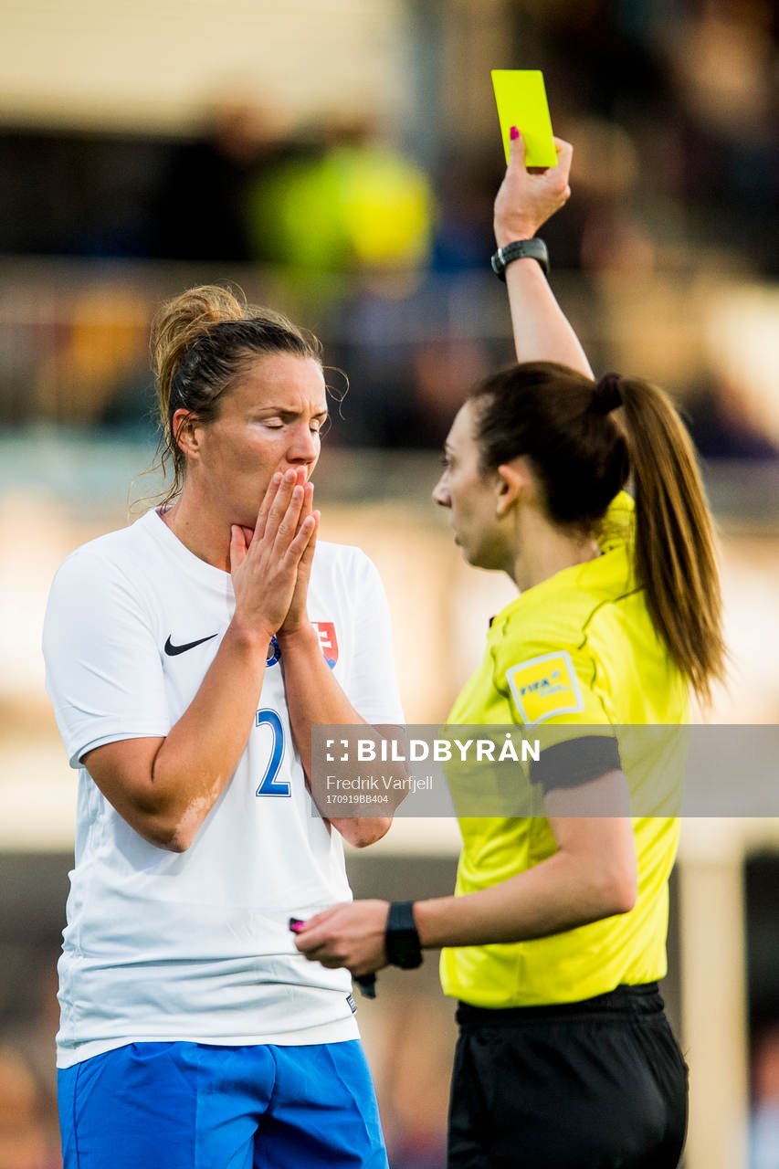 Lucie Harsanyova of Slovakia is shown a yellow card by The