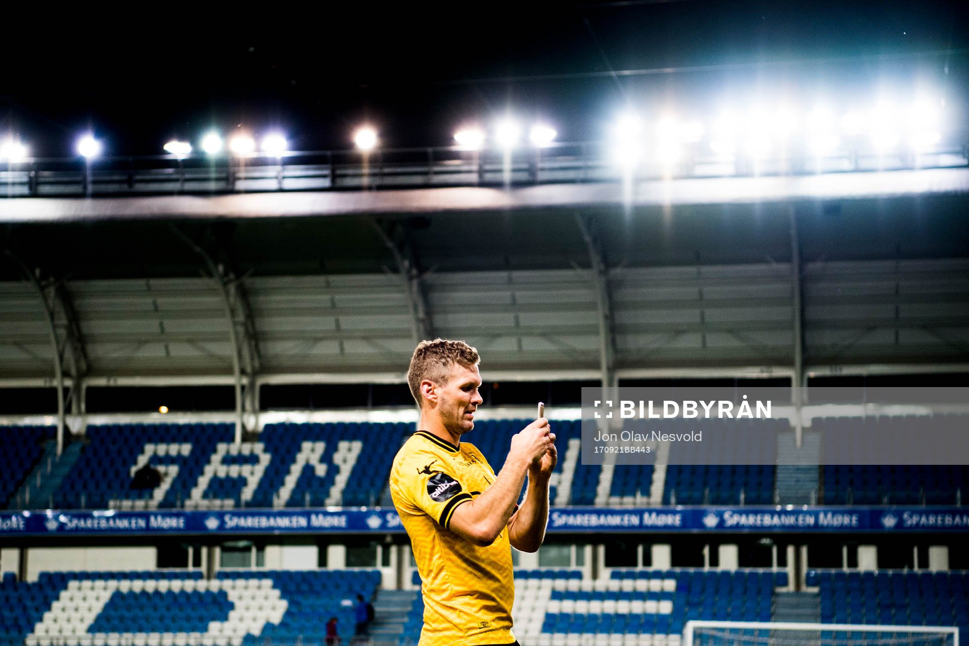 Frode Kippe of Lillestrøm takes a photo with his phone