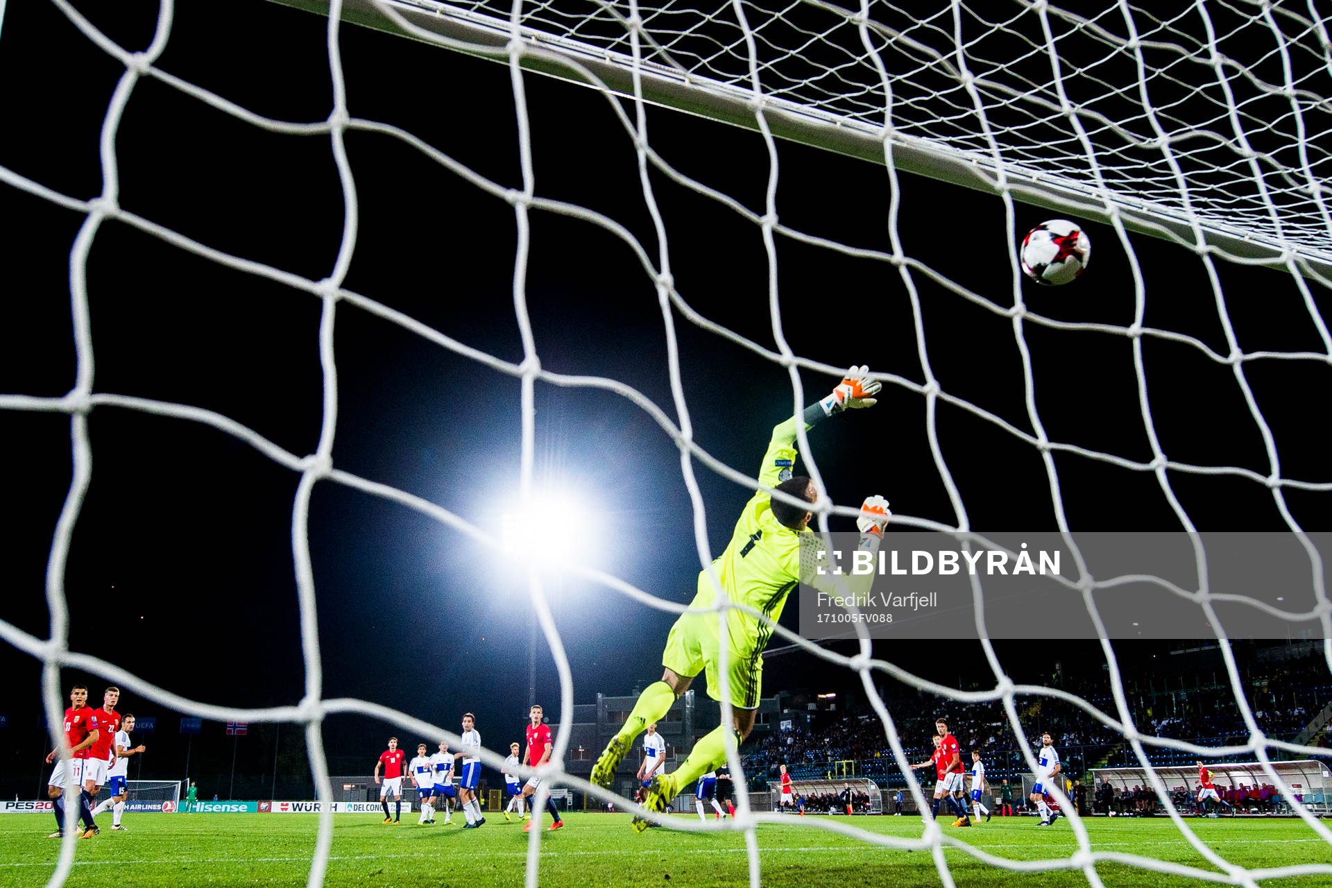 Ole Kristian Selnæs of Norway scores 6-0 behind goalkeeper