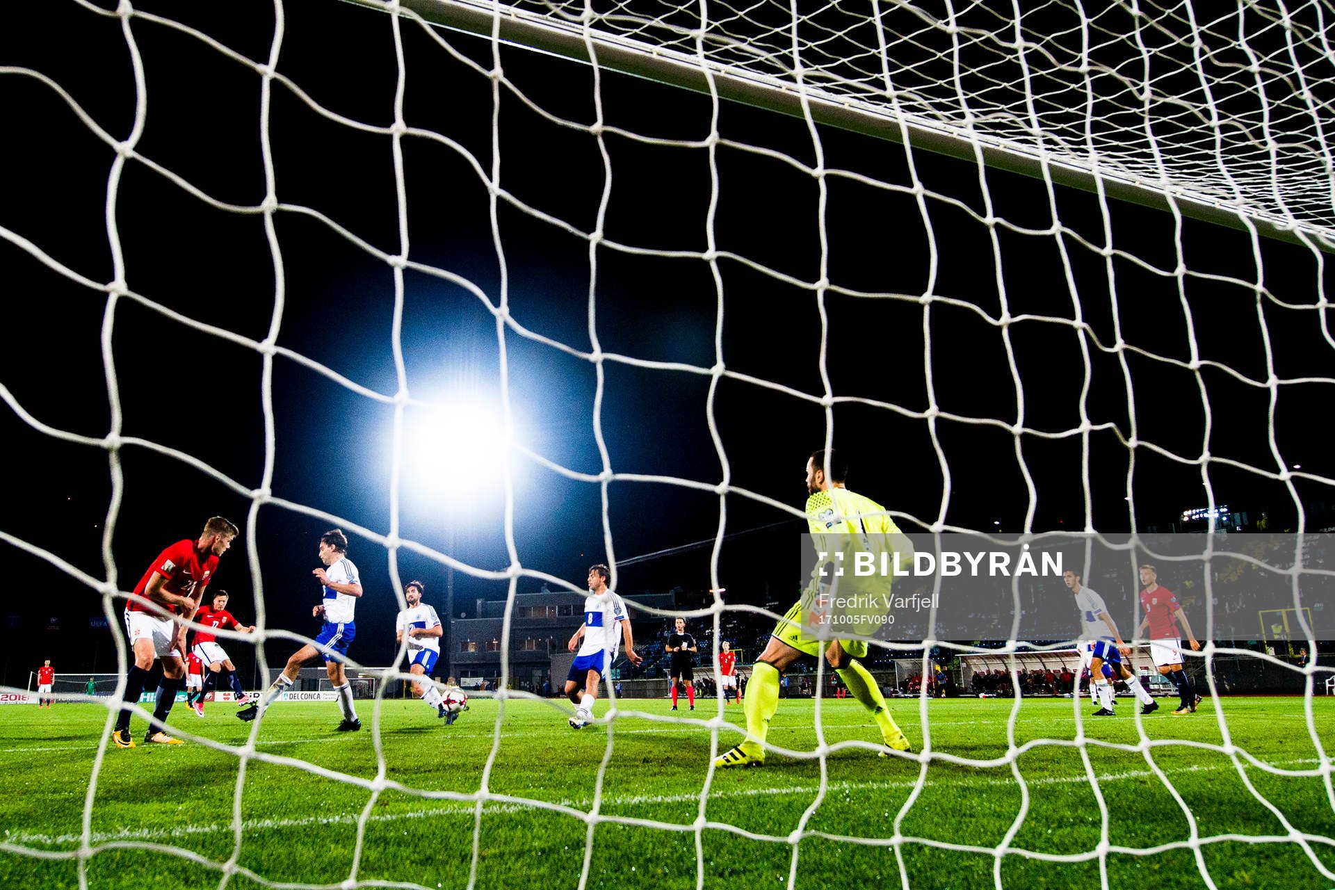 Martin Linnes of Norway scores 8-0 behind goalkeeper Aldo