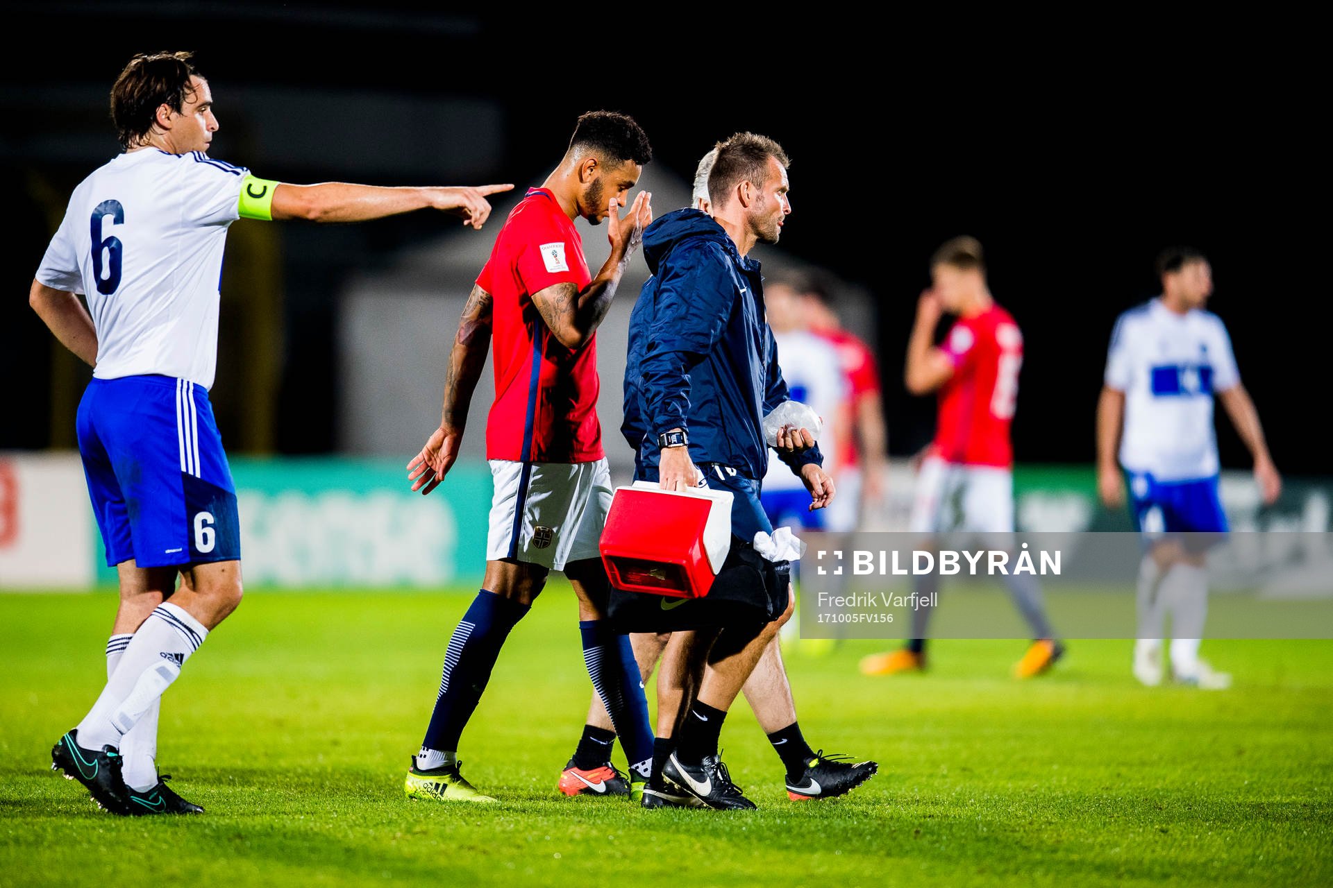 Joshua King of Norway walks off the pitch with an injury