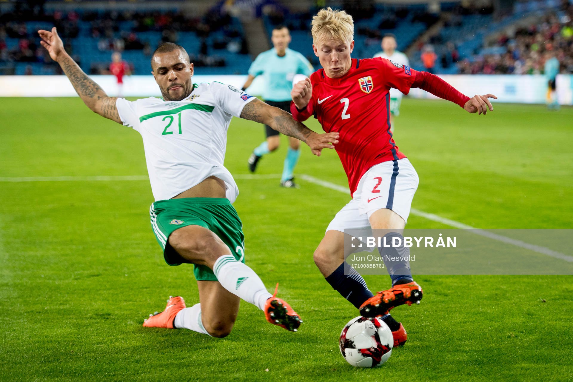 Josh Magennis of Northern Ireland and Birger Meling of
