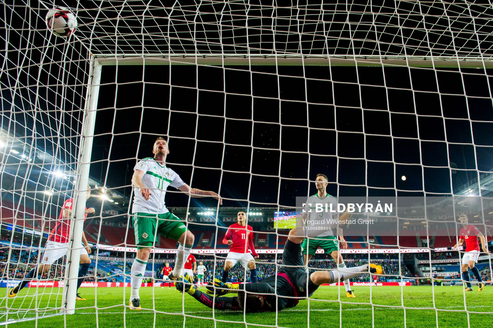 Chris Brunt of Northern Ireland scores an own goal