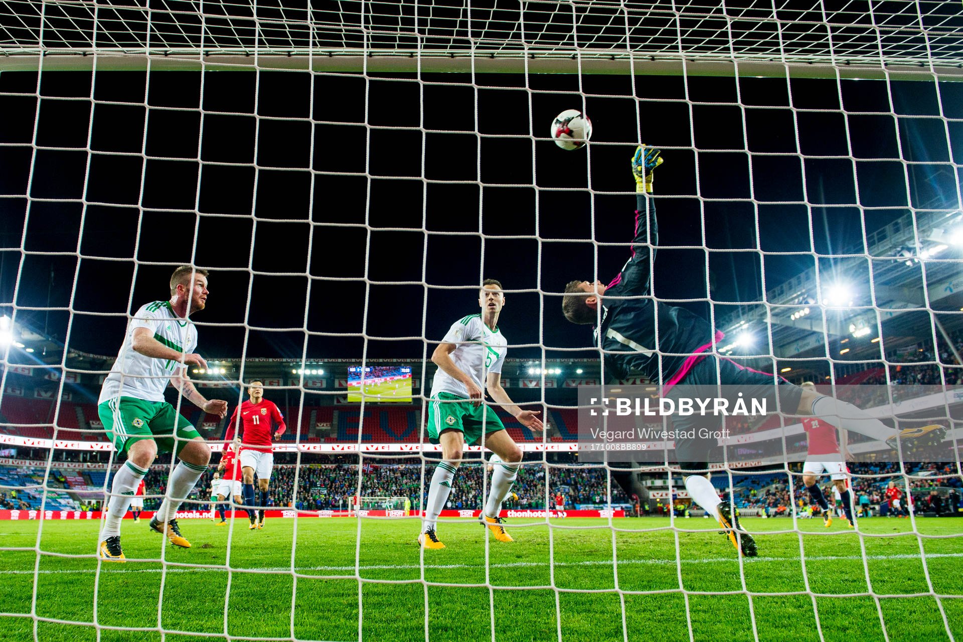 Chris Brunt of Northern Ireland scores an own goal