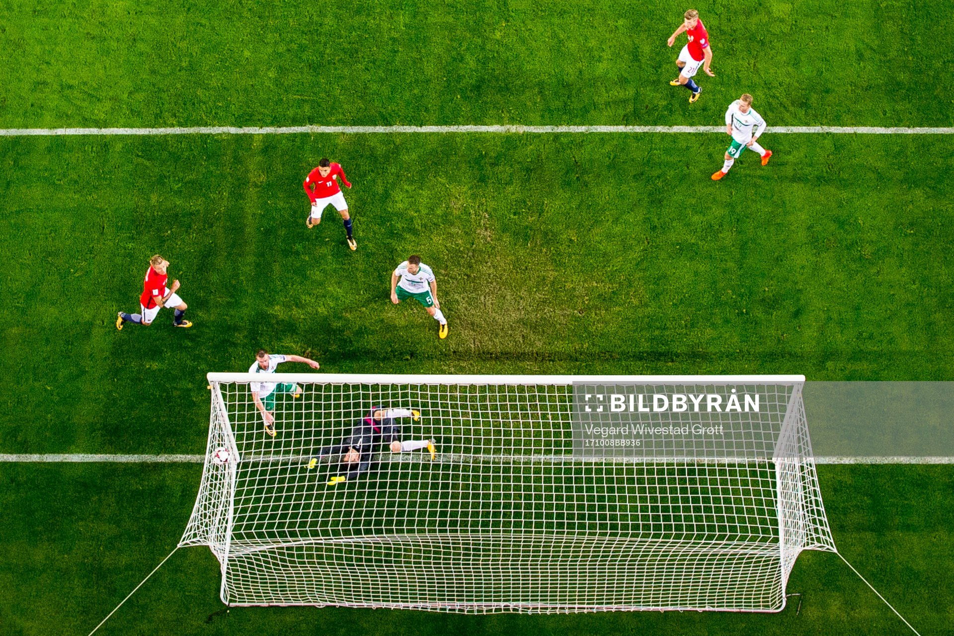 Chris Brunt of Northern Ireland scores an own goal