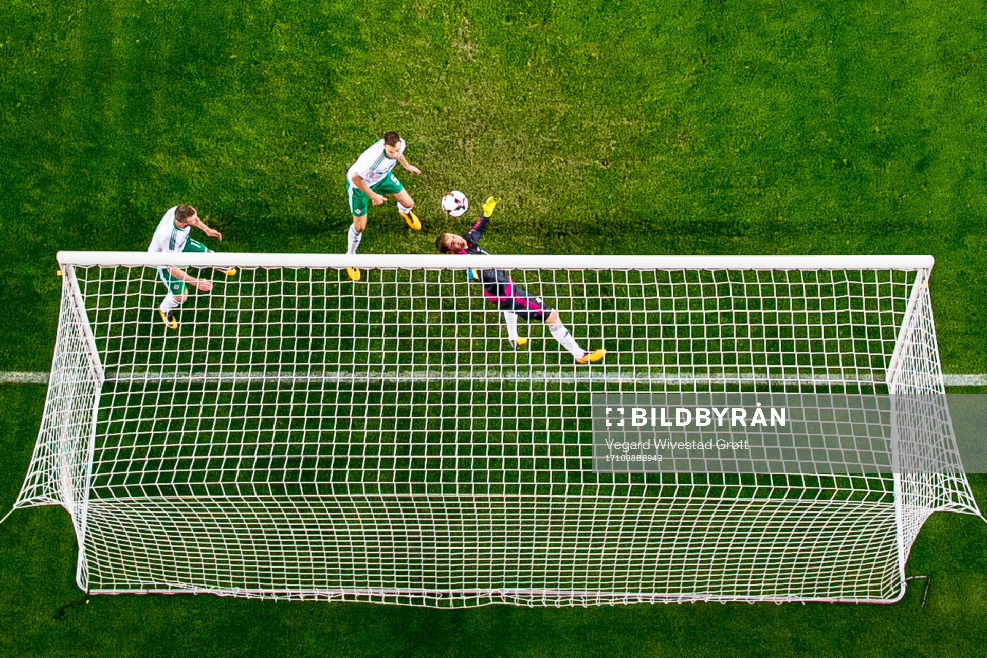 Chris Brunt of Northern Ireland scores an own goal
