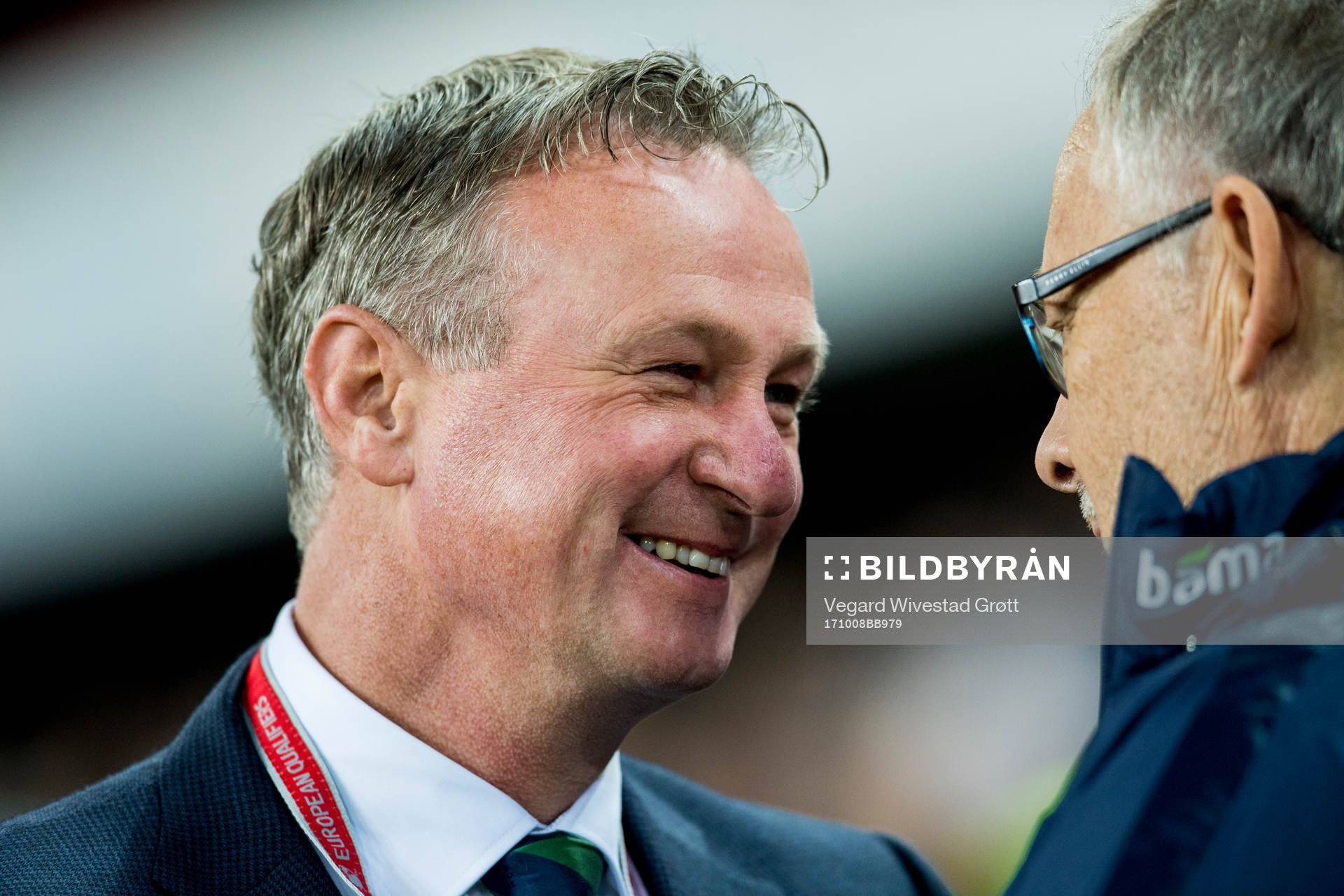 Michael O'Neill, head coach of Northern Ireland, talks to