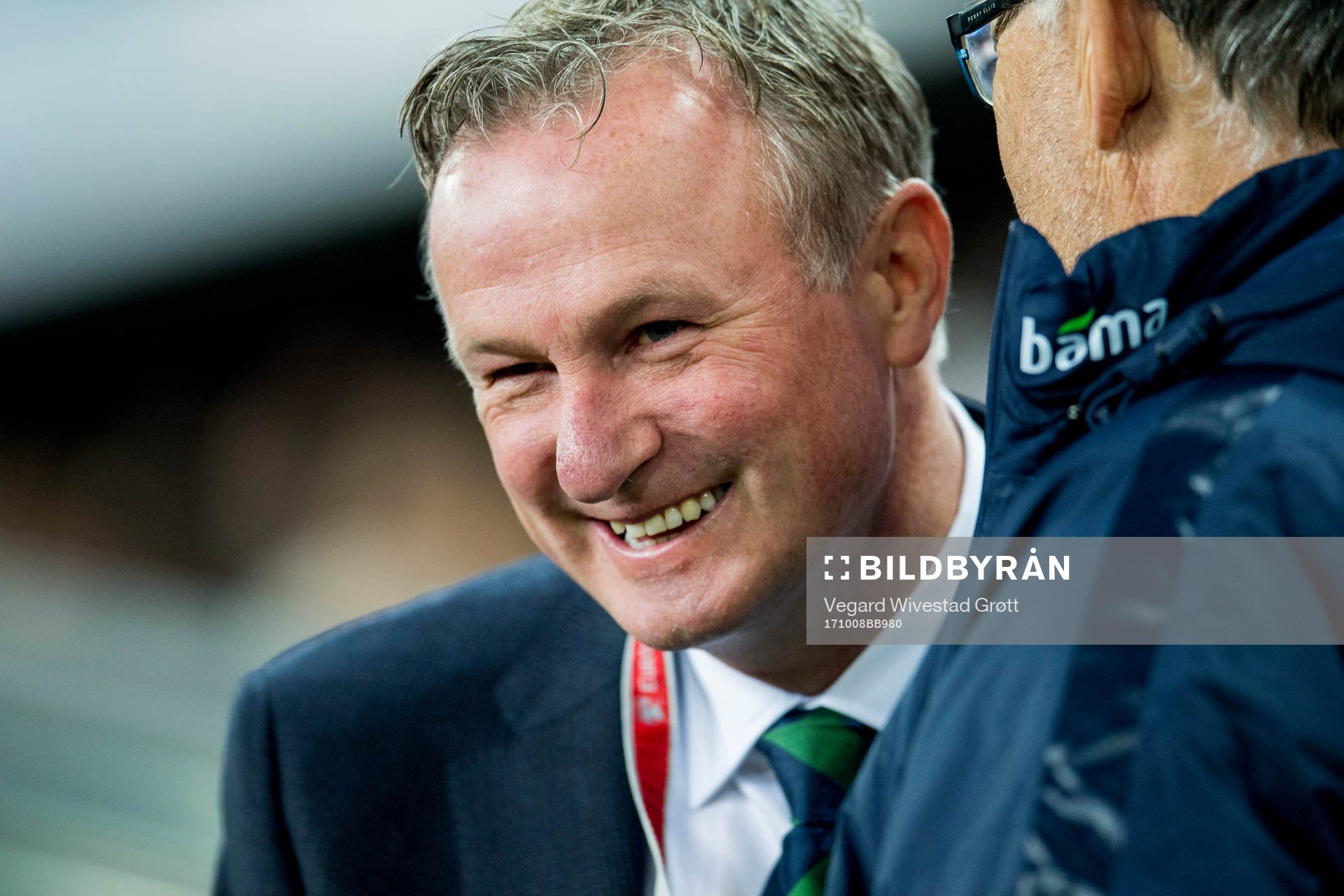 Michael O'Neill, head coach of Northern Ireland, talks to
