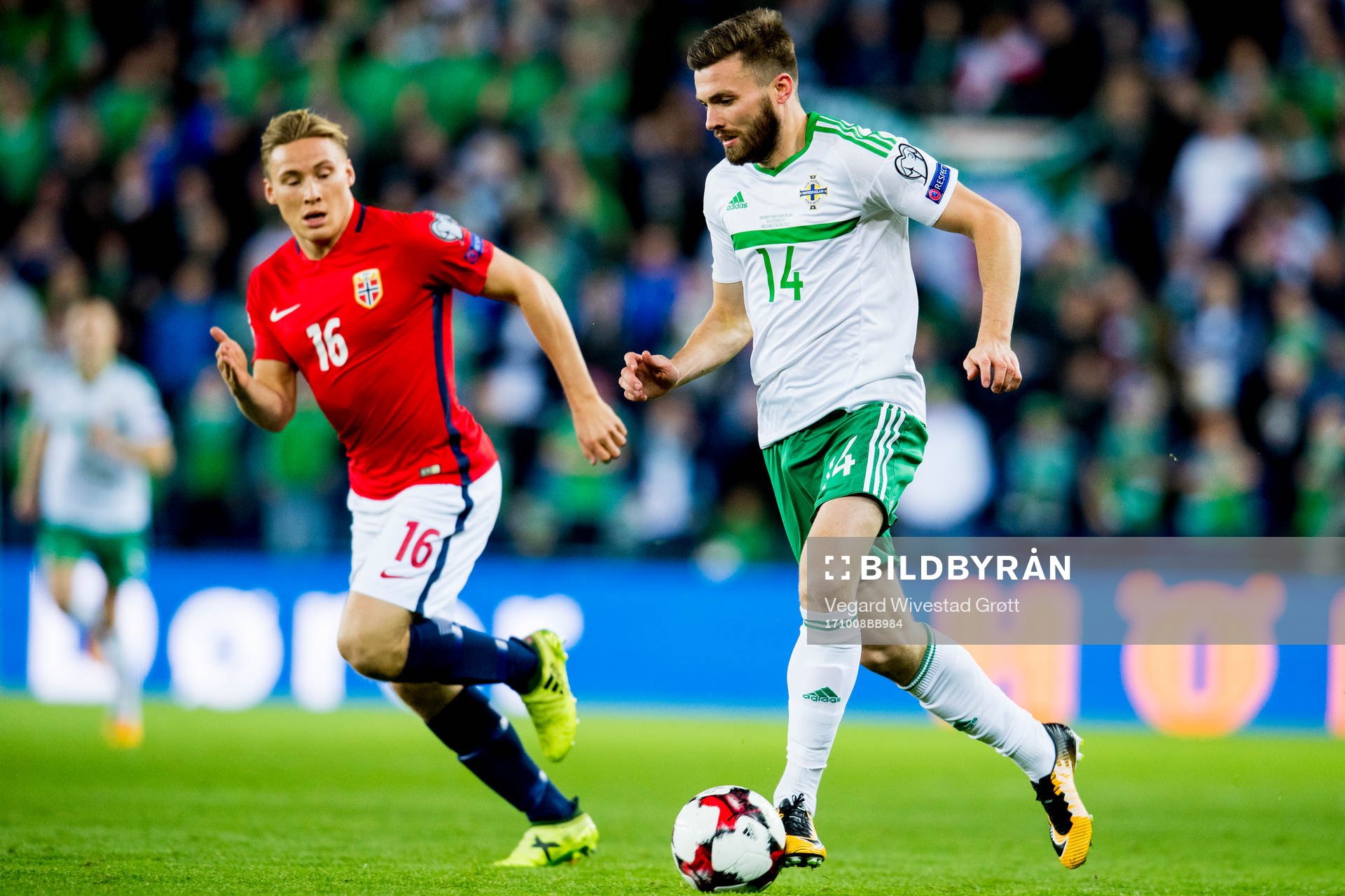 Jonas Svensson of Norway and Stuart Dallas of Northern