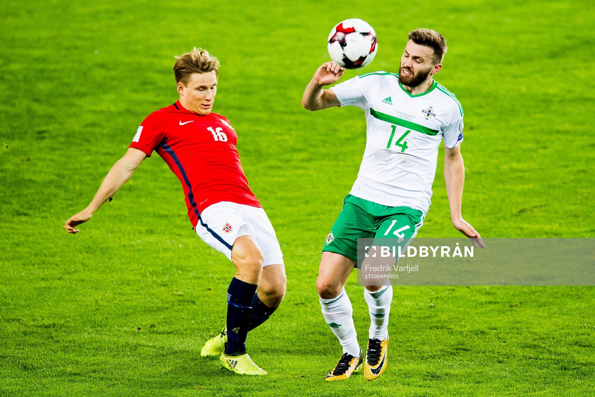 Jonas Svensson of Norway and Stuart Dallas of Northern