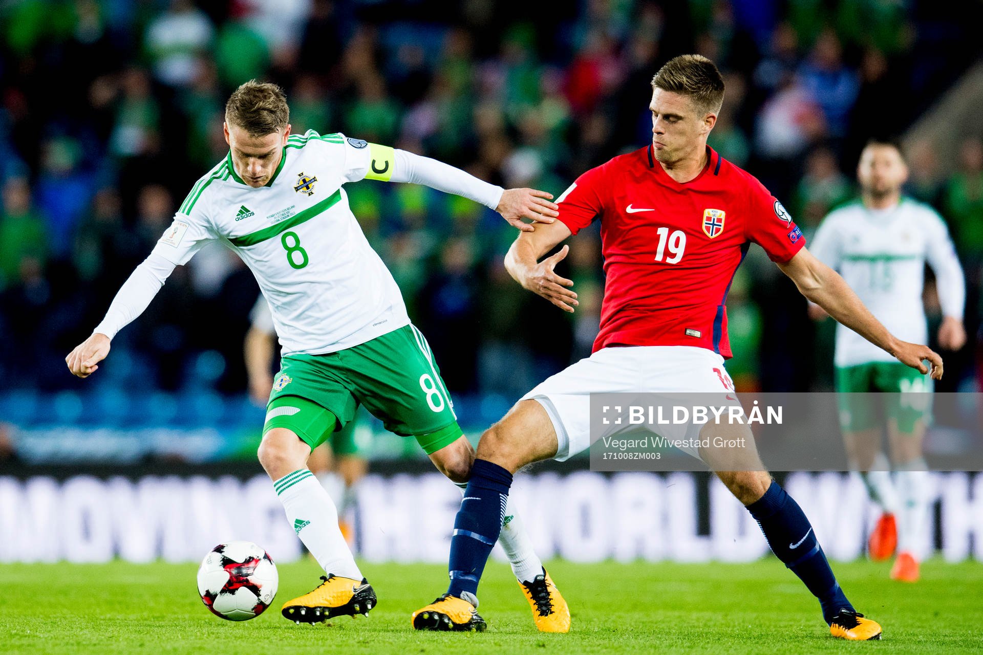Steven Davis of Northern Ireland and Markus Henriksen of