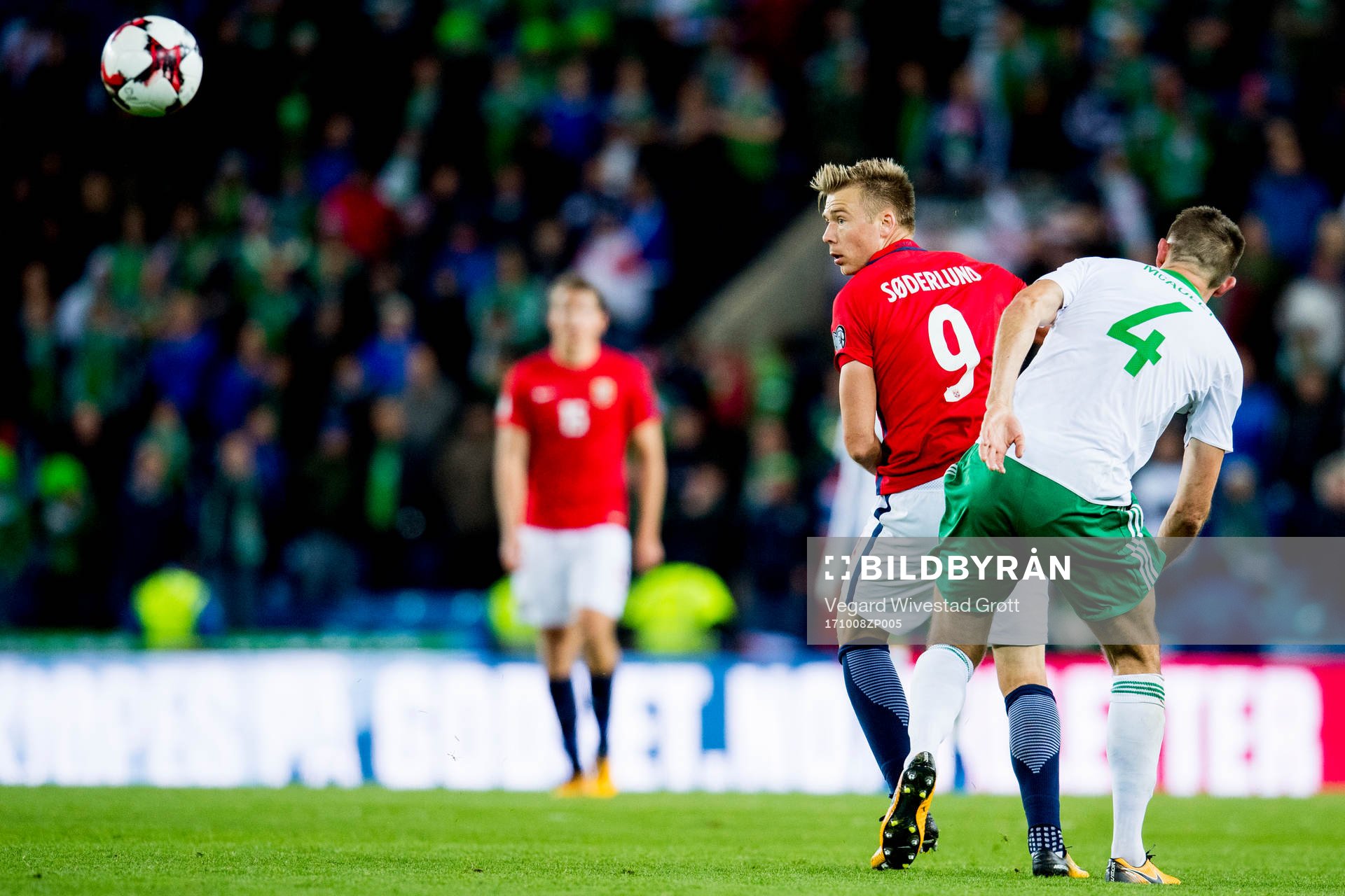 Alexander Toft Søderlund of Norway and Gareth McAuley of