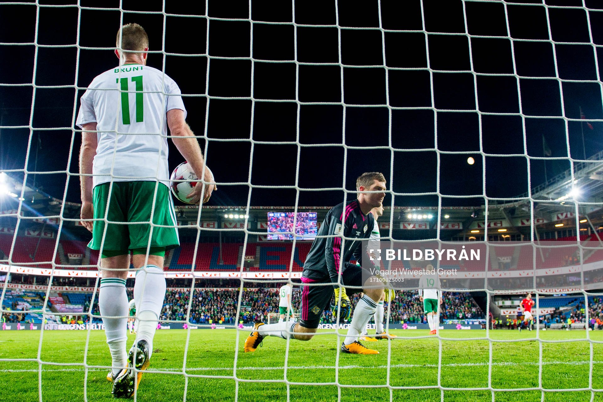 Chris Brunt and goalkeeper Michael McGovern of Northern