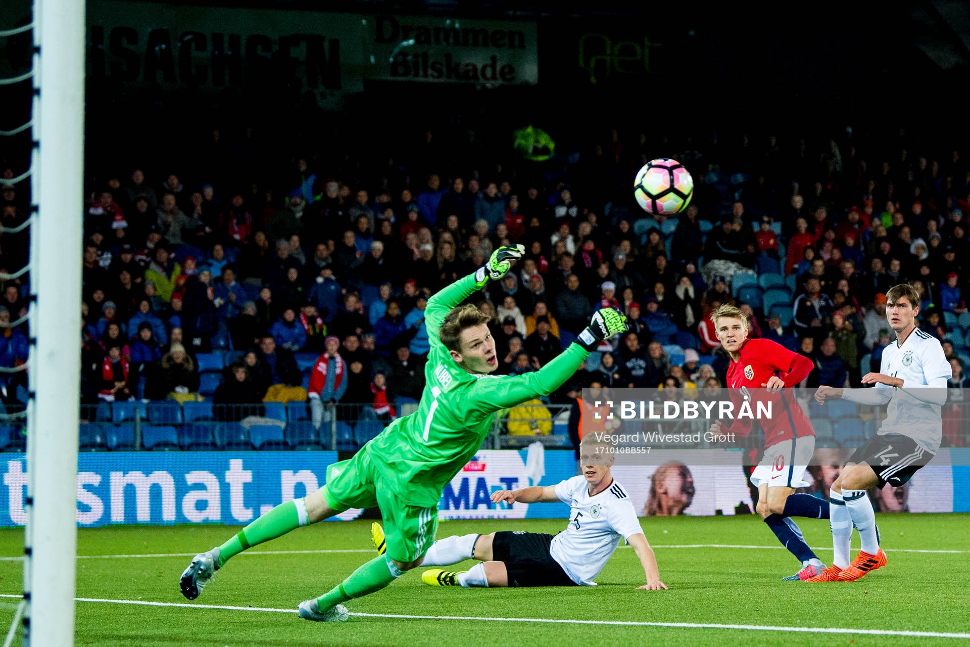 Martin Ødegaard of Norway scores 2-1 behind goalkeeper