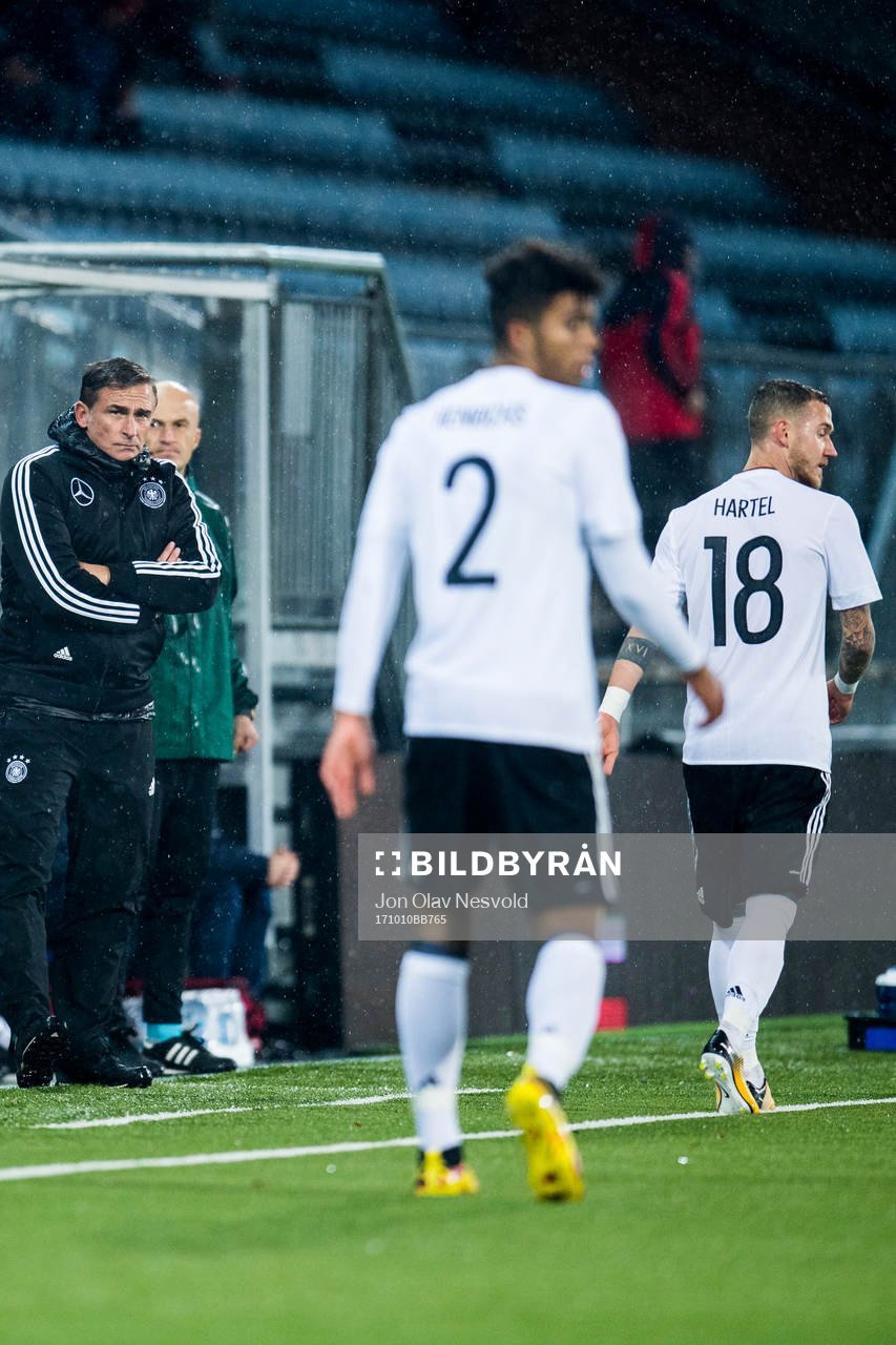 Stefan Kuntz, head coach of Germany, Benjamin Henrichs and
