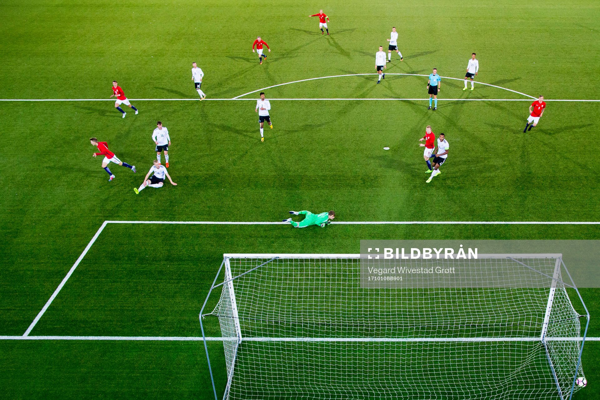 Martin Ødegaard of Norway scores 2-1 behind goalkeeper