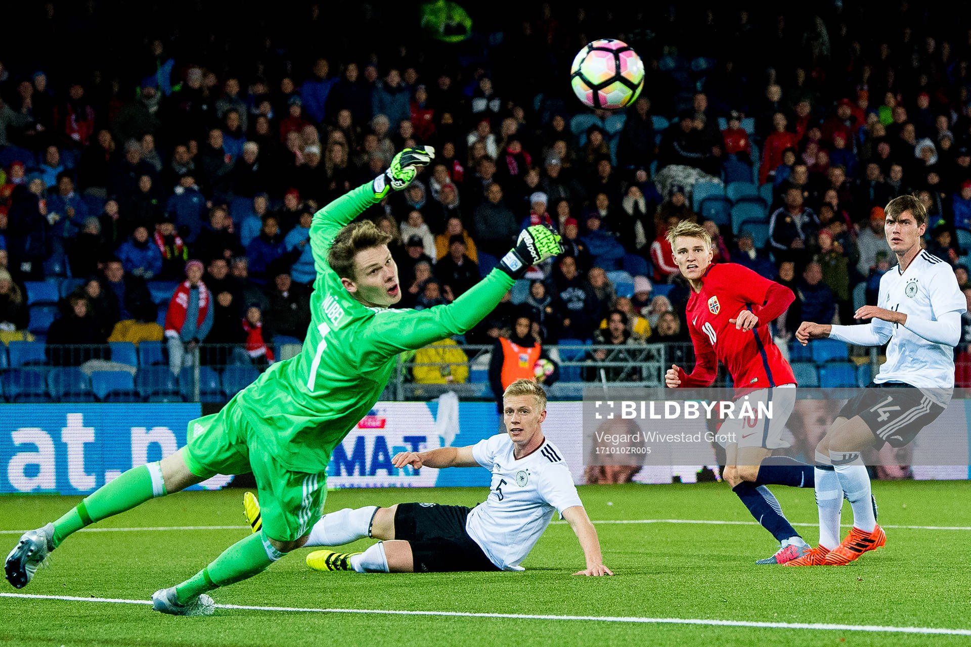 Martin Ødegaard of Norway scores 2-1 behind goalkeeper
