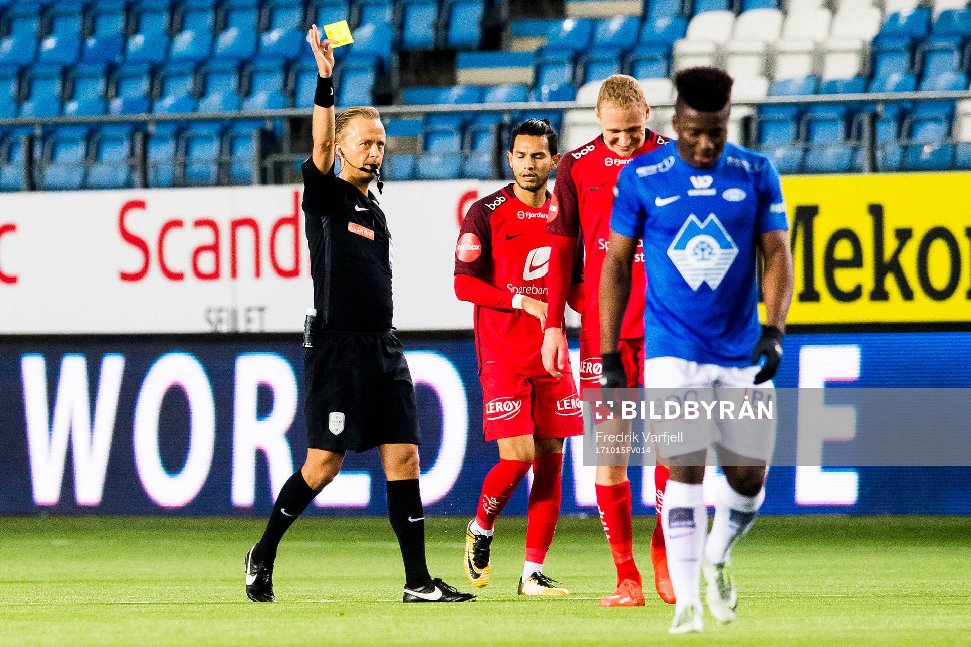 Kristoffer Barmen of Brann is shown the yellow card by Ola